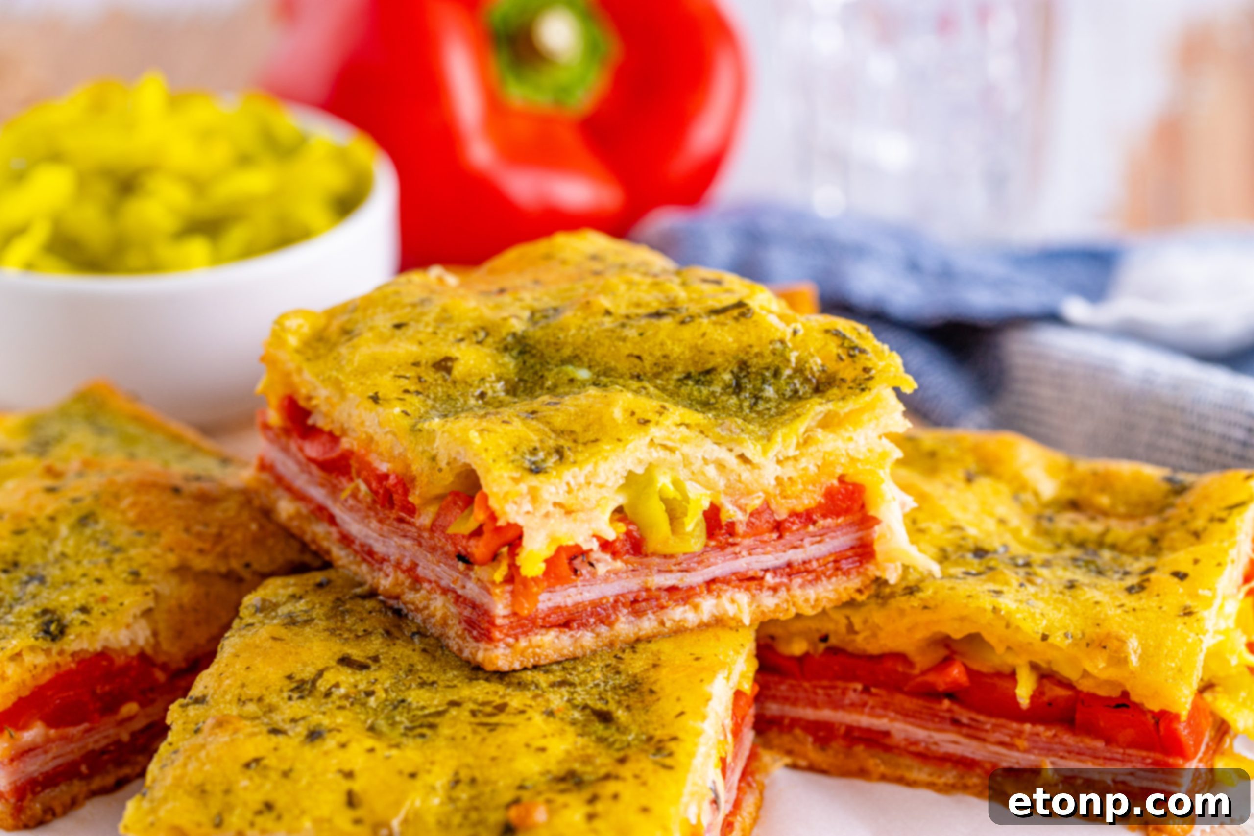 A final close-up of a perfectly baked Italian Antipasto Square, showcasing the crispy crust and savory filling.