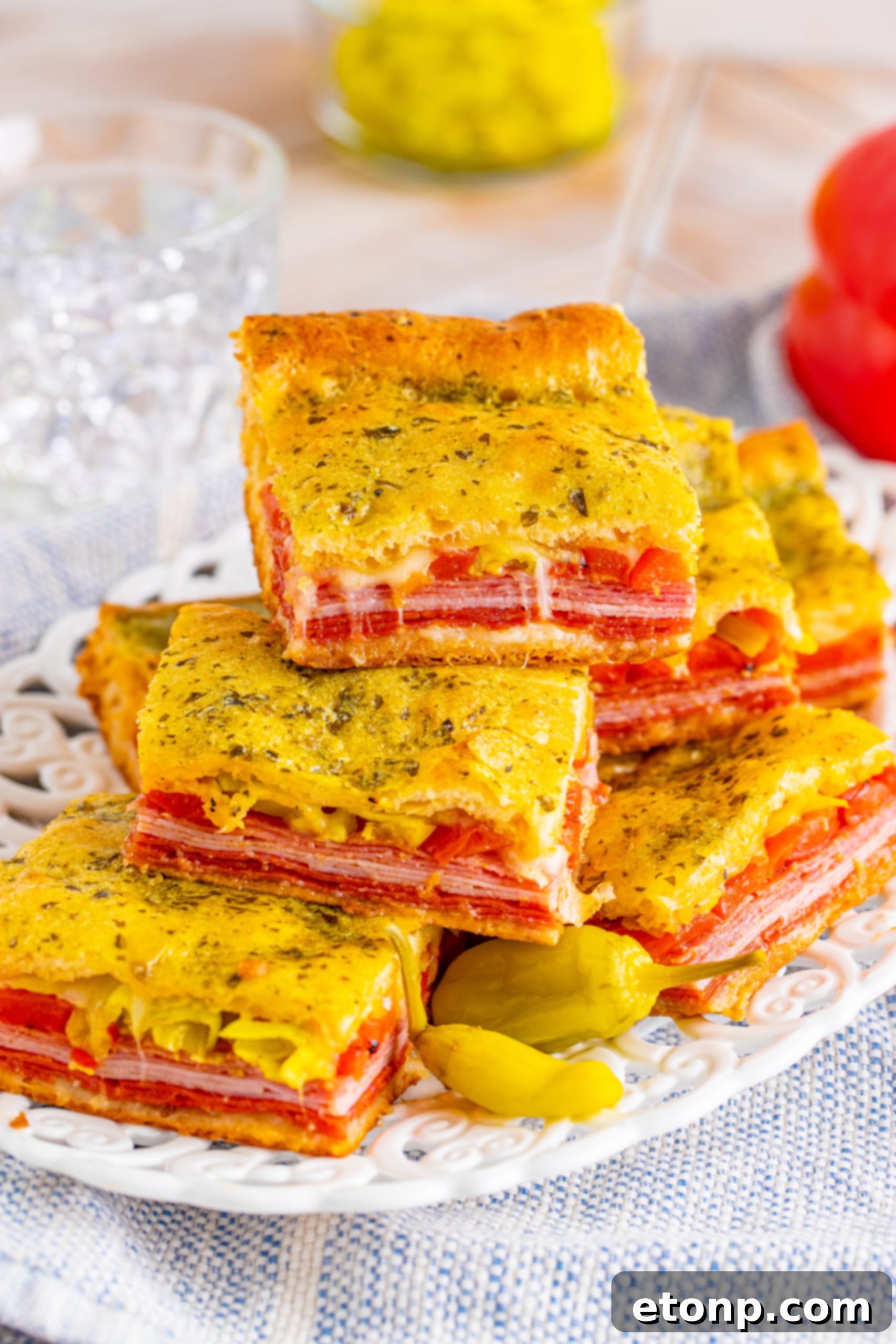 A freshly baked pan of golden-brown Italian Antipasto Squares, ready to be cut and served.