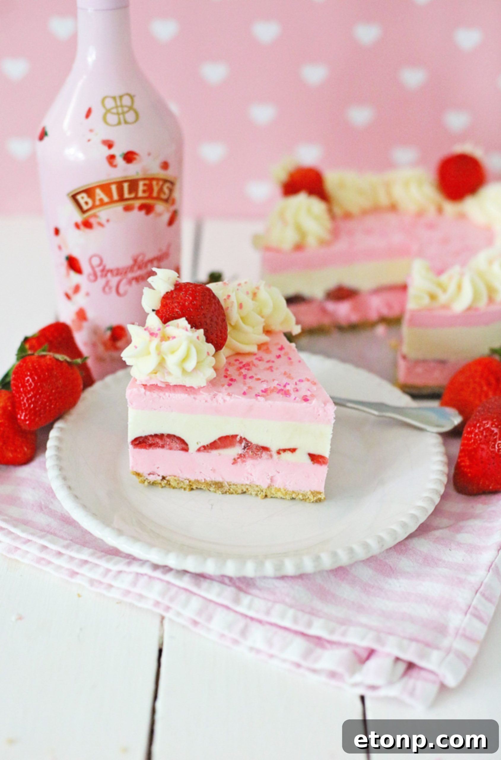 No-Bake Baileys Strawberry Cheesecake Bliss 13 Baileys Strawberries & Cream bottle next to fresh strawberries