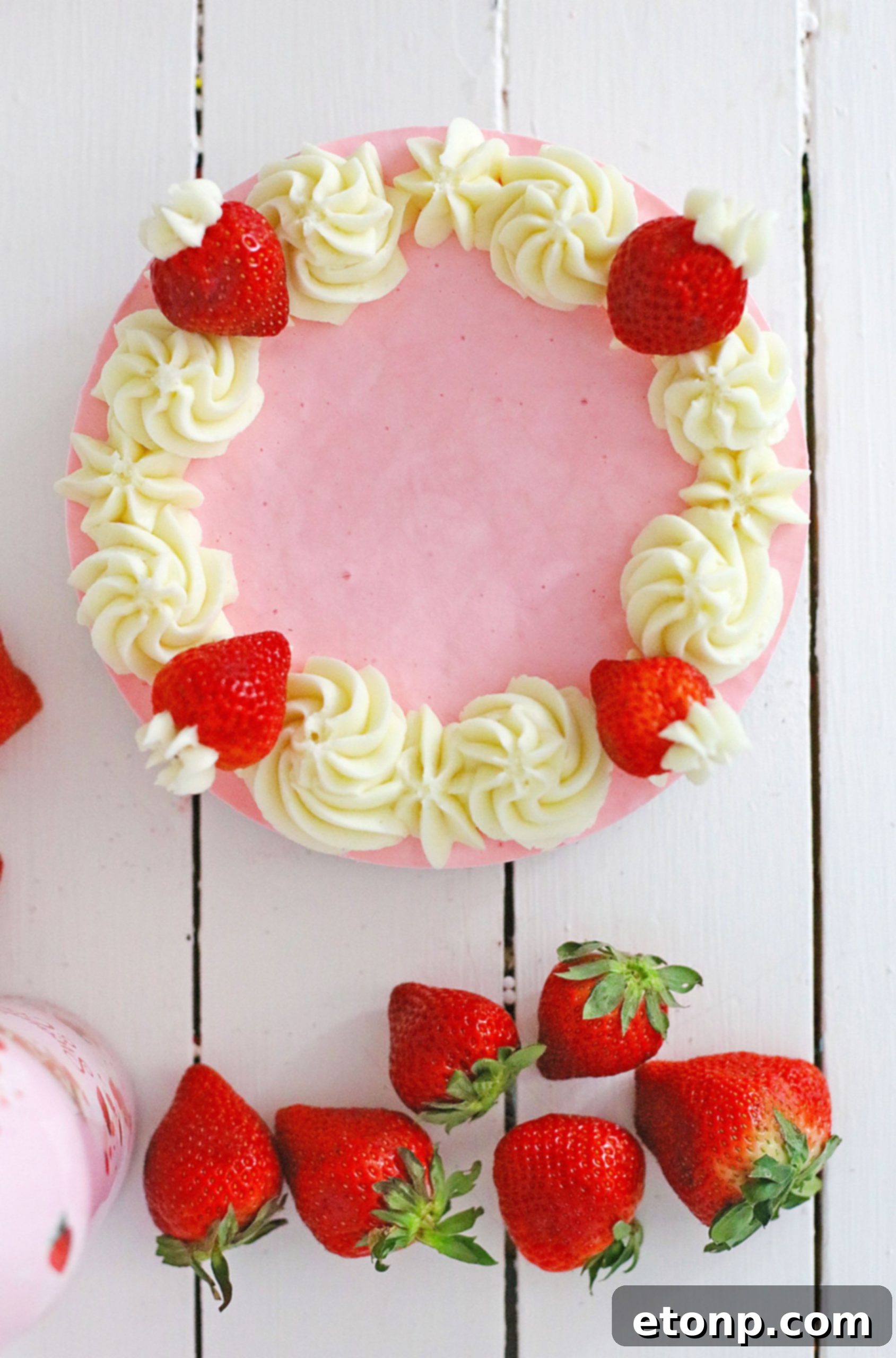No-Bake Baileys Strawberry Cheesecake Bliss 7 Baileys Strawberries & Cream bottle with cheesecake in the background