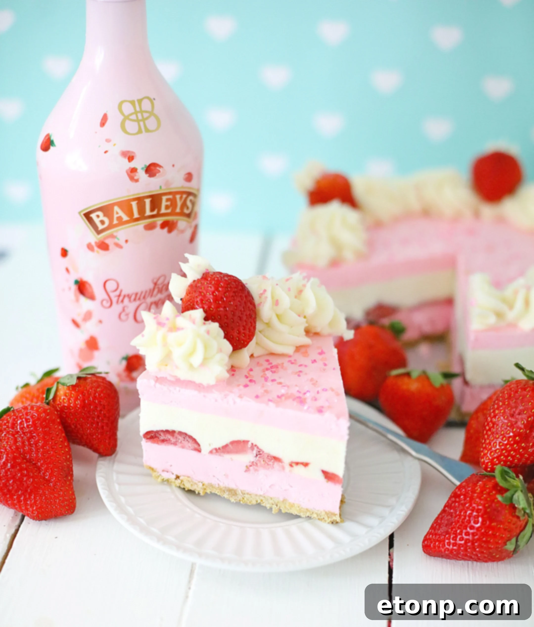 No-Bake Baileys Strawberry Cheesecake Bliss 8 Baileys Strawberries & Cream Cheesecake slice on a fork