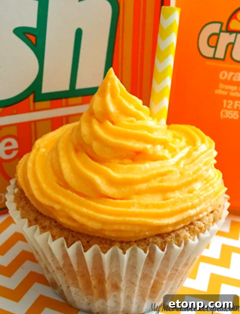 Delicious Orange Creamsicle CRUSH Cupcakes with vibrant frosting and a paper straw