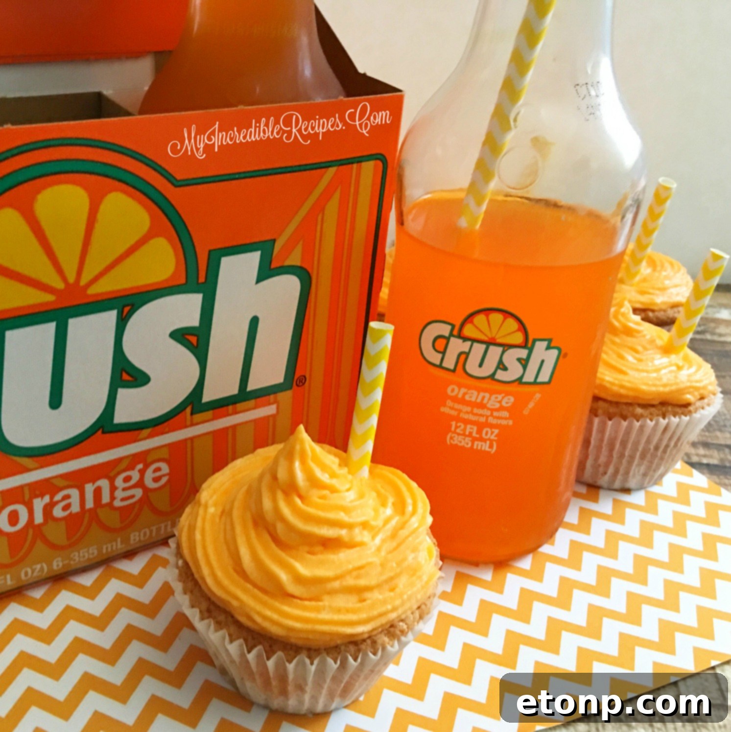 Artfully arranged Orange Creamsicle Cupcakes, showcasing their uniform frosting and delightful appearance