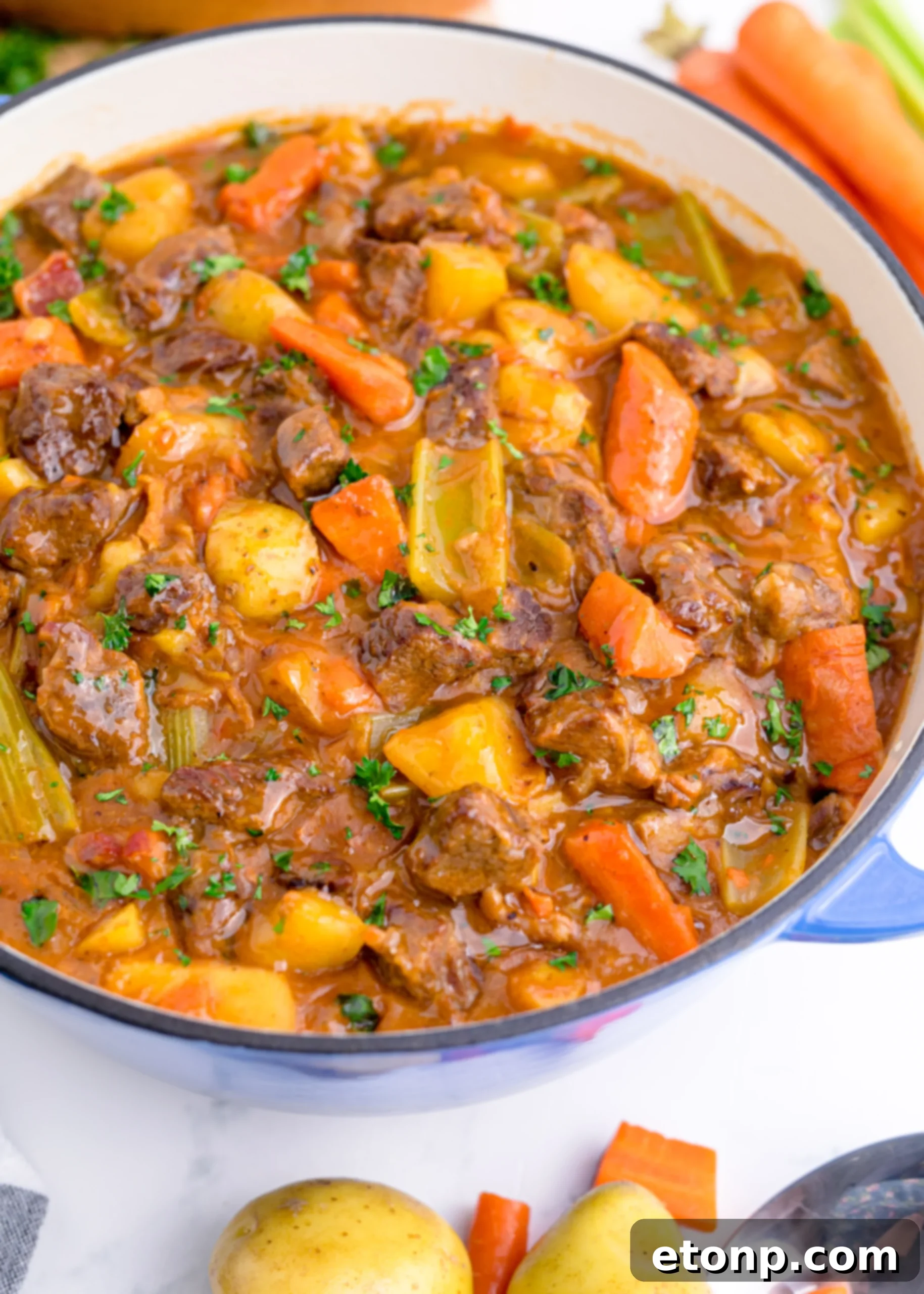 A generous serving of Guinness Beef Stew in a rustic bowl, ready to be enjoyed.