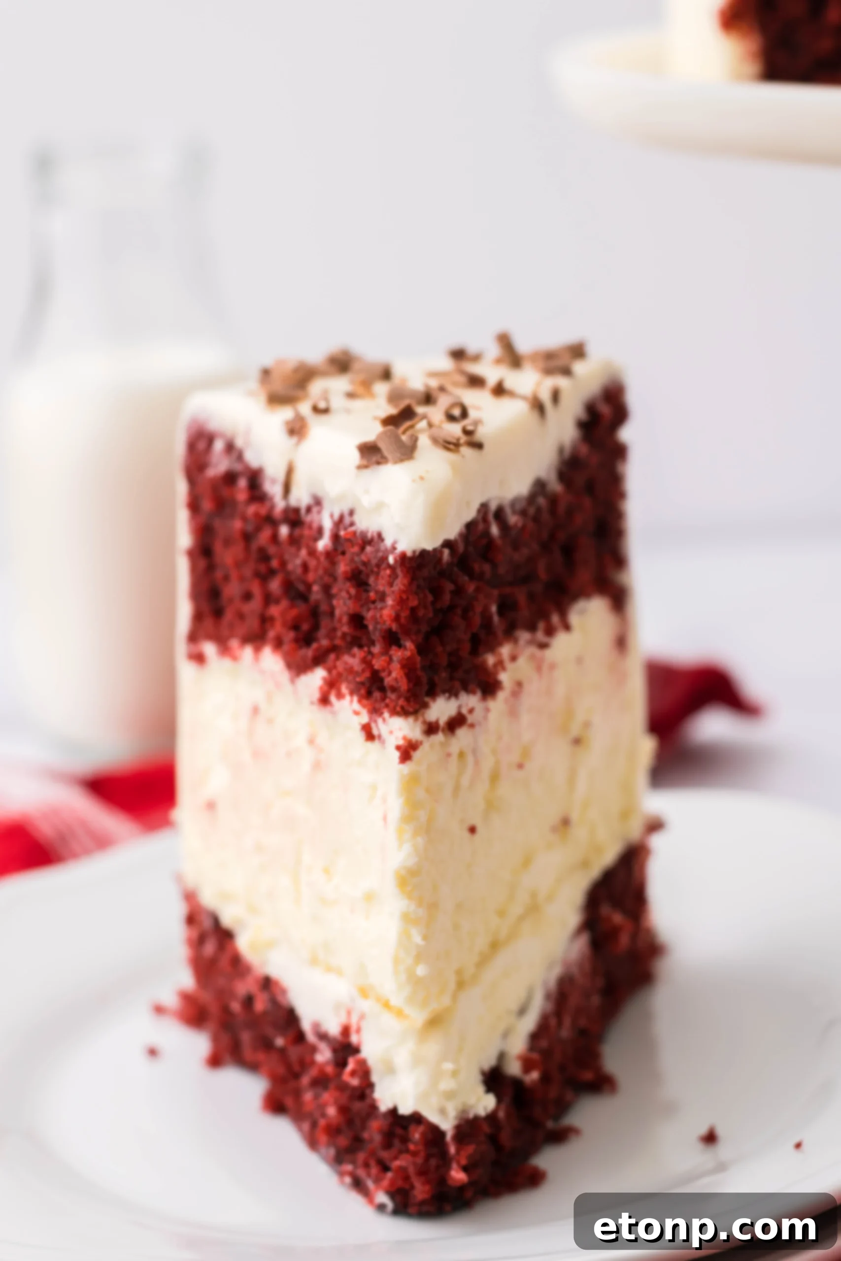 A delightful final shot of the Red Velvet Cheesecake Cake, ready to be enjoyed.