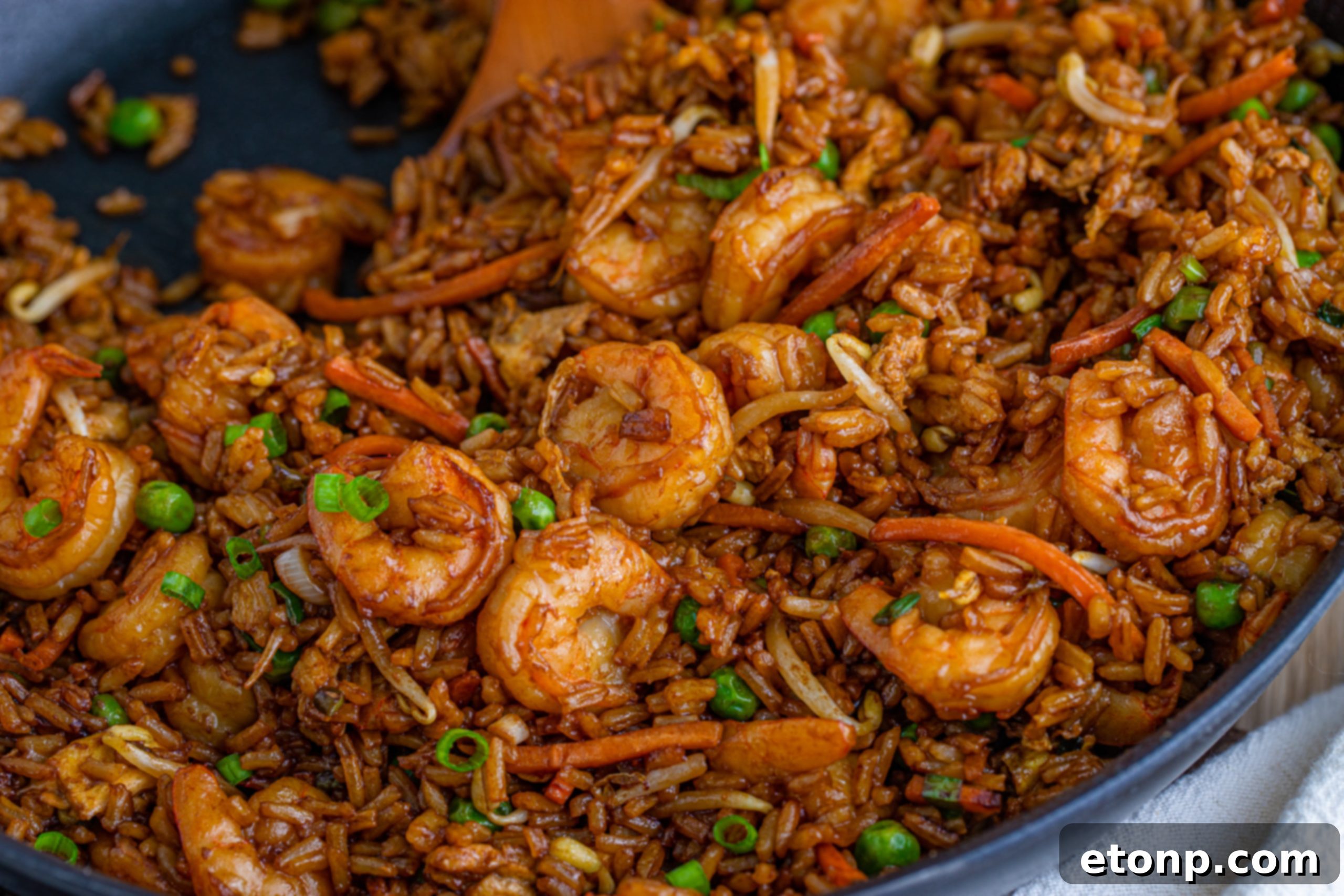 Golden Shrimp Fried Rice 13 A bottle of toasted sesame oil, emphasizing its rich color and culinary importance.