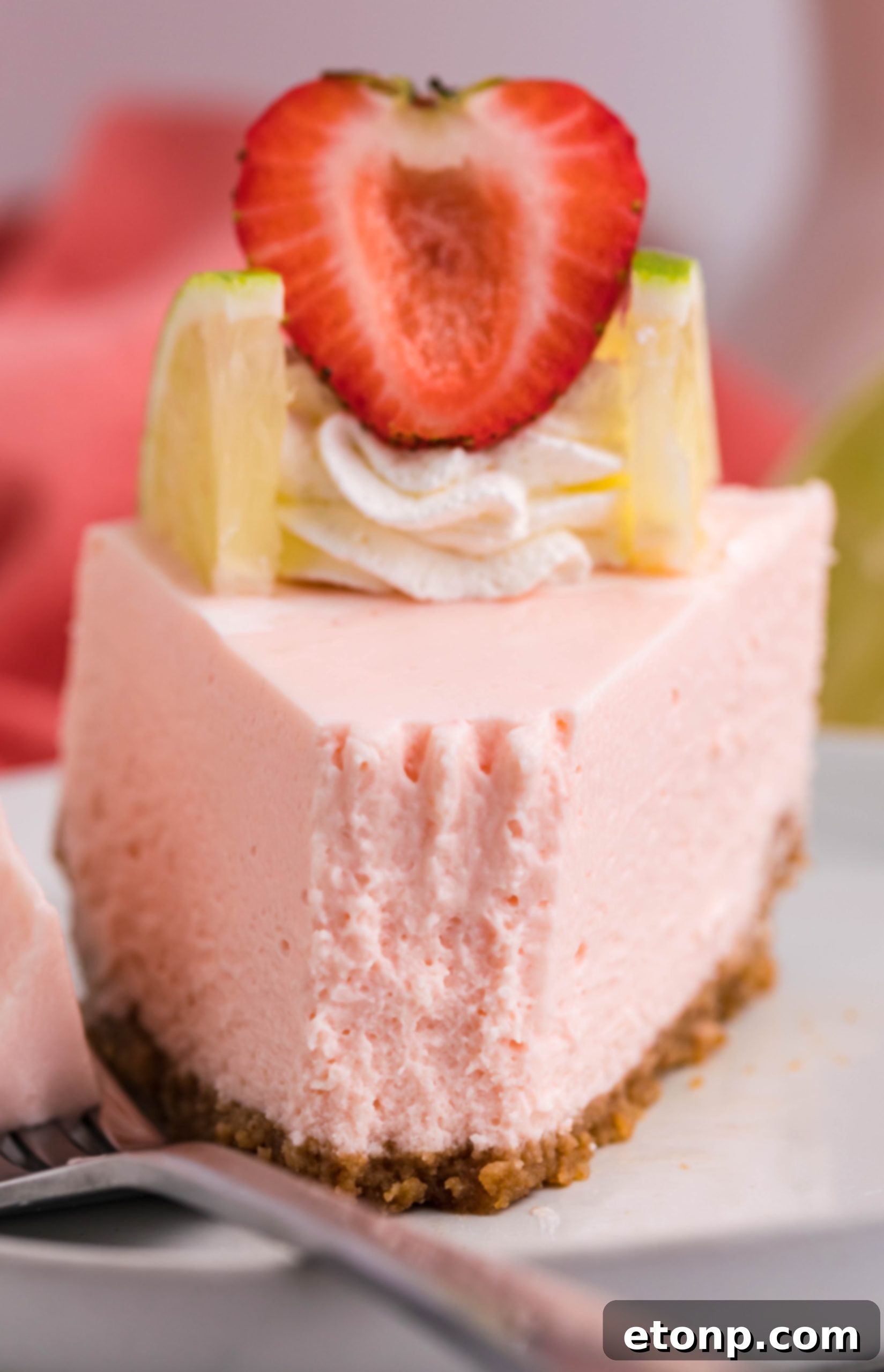 Vibrant Instant Pot Strawberry Daiquiri Cheesecake 6 Close-up on the texture of Instant Pot Strawberry Daiquiri Cheesecake