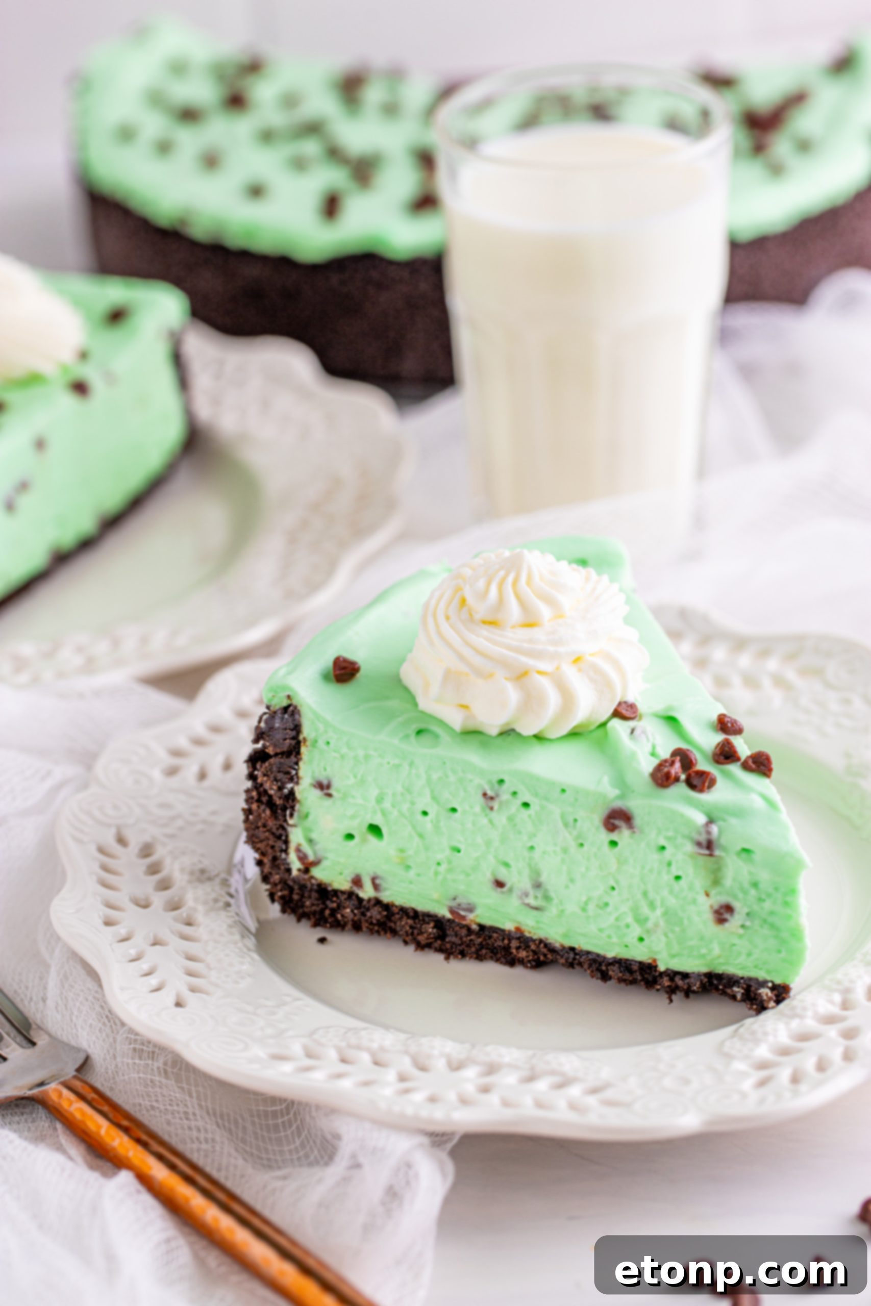 Fluffy and creamy no-bake mint chocolate chip cheesecake, resembling mint chocolate chip ice cream