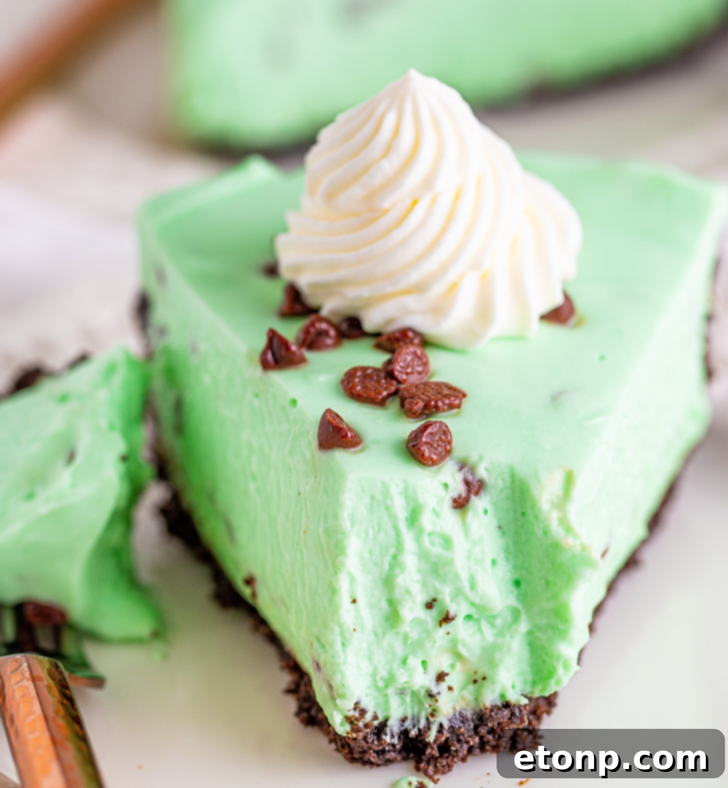 Multiple slices of the no-bake mint chocolate chip cheesecake, showcasing the perfect texture and inviting presentation