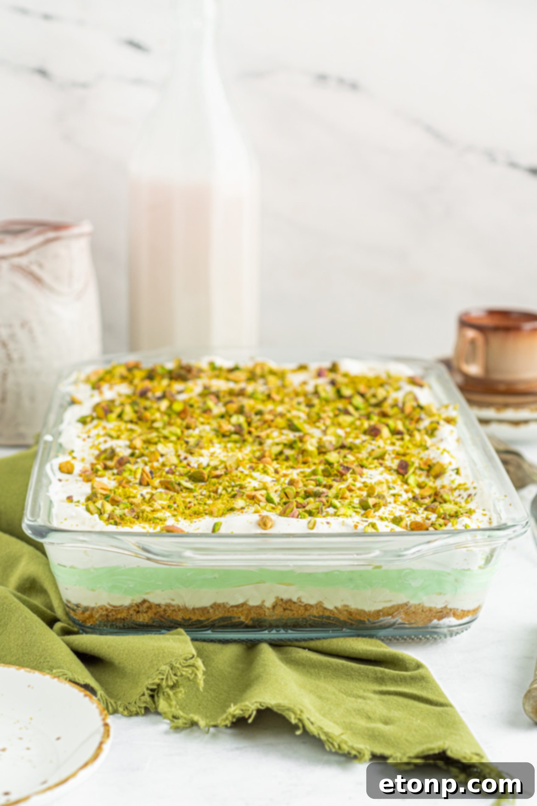 Pistachio Lush Dessert from a slightly elevated angle, showing the height and different layers clearly.