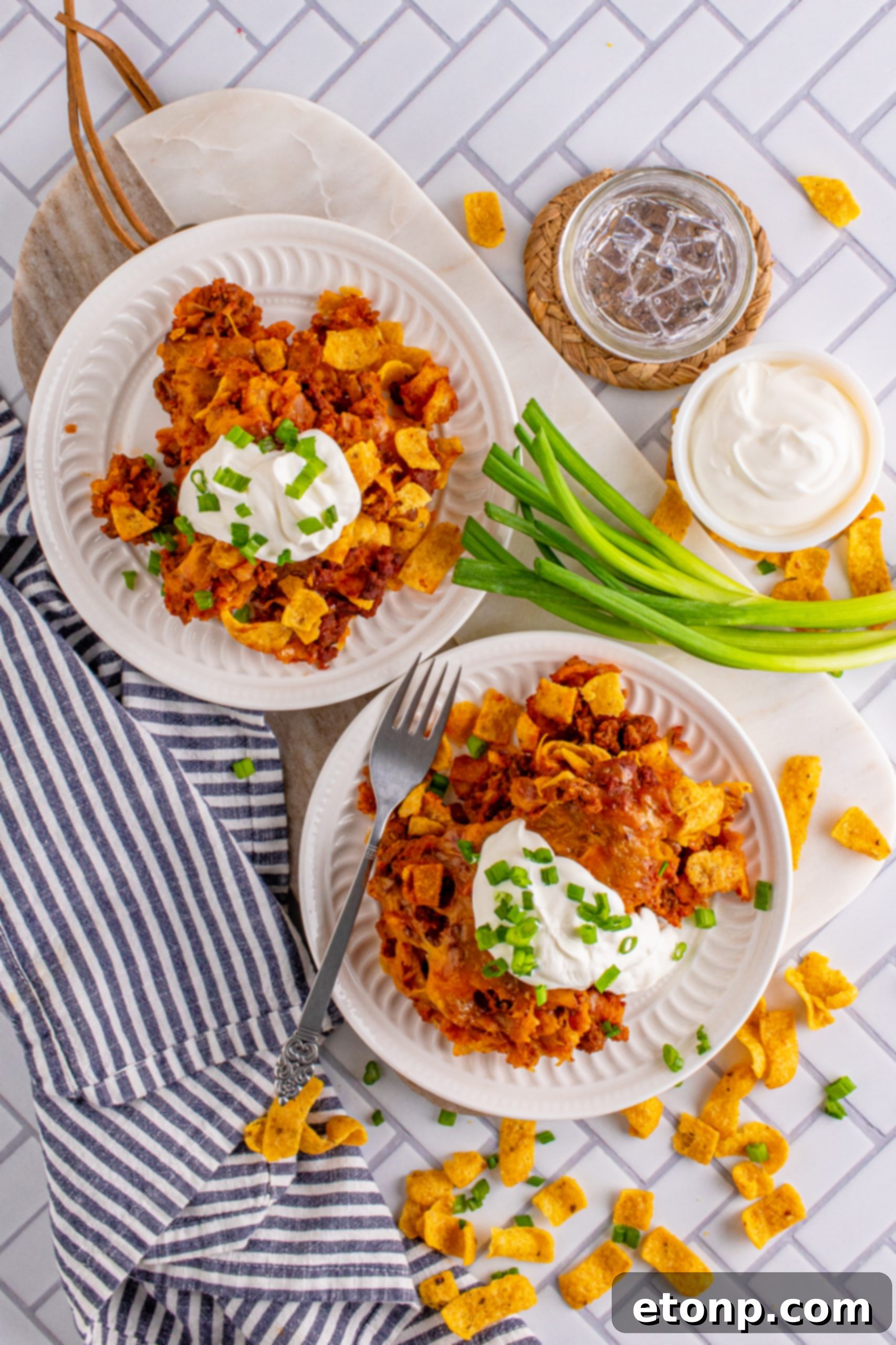 Close-up of a serving of Frito Chili Casserole with a fork