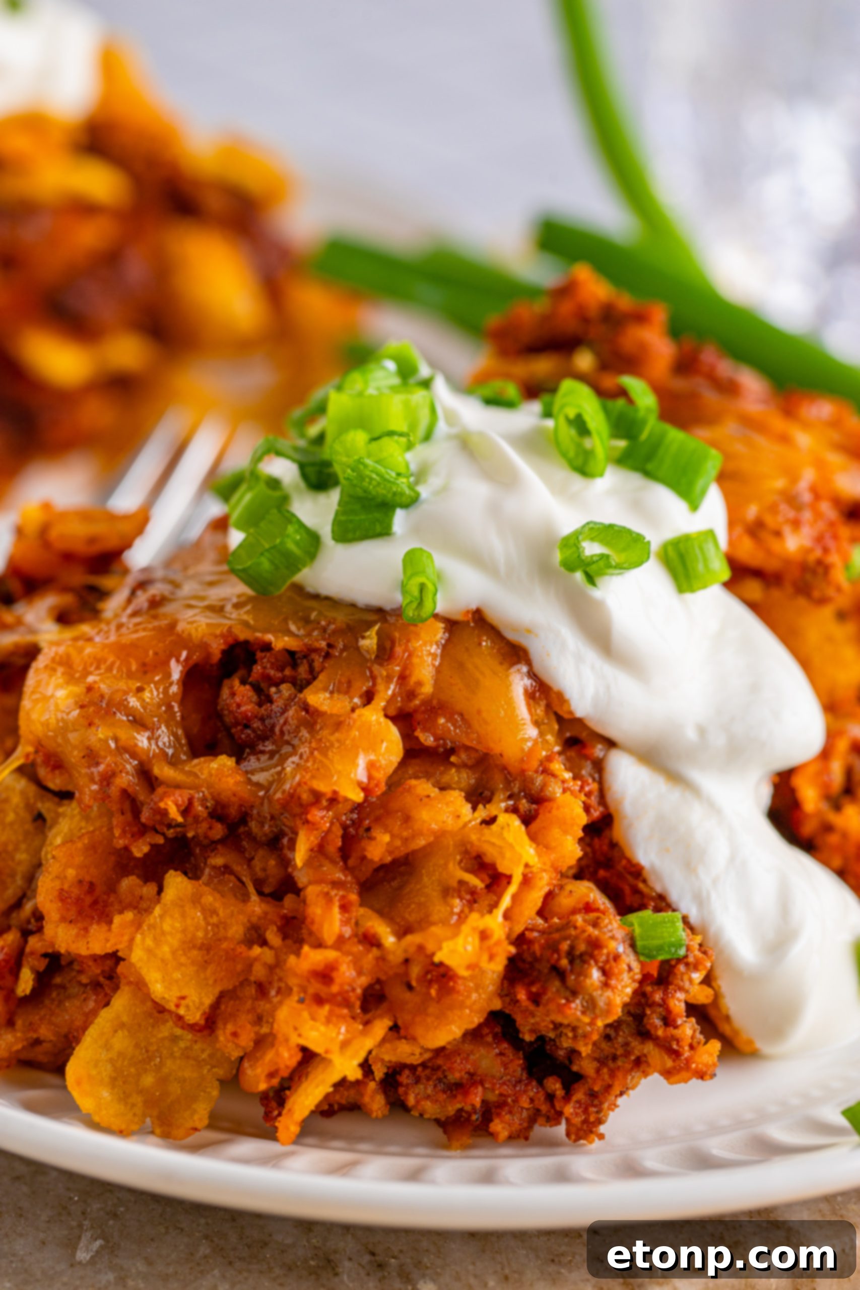 Table spread with a variety of dishes including the Frito Chili Casserole