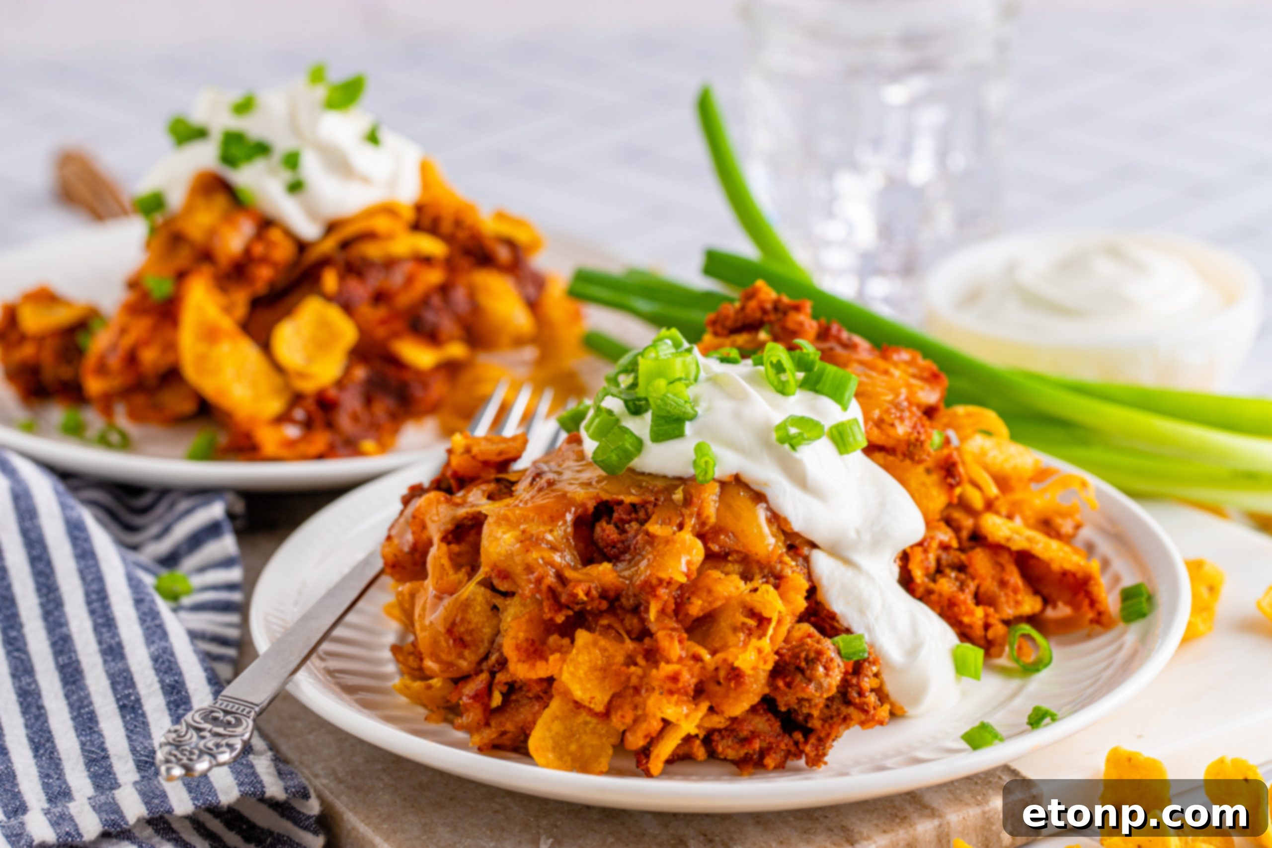 Close up view of the crispy Fritos on the edge of the casserole dish