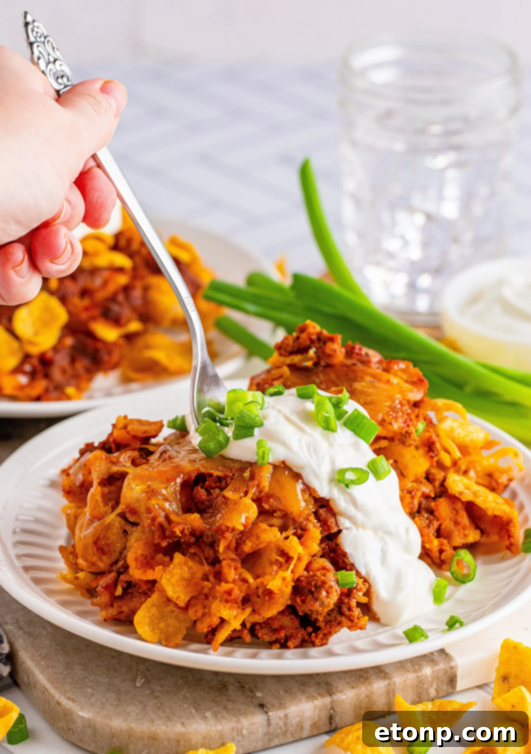 Close-up of the Frito Chili Casserole with melted cheese