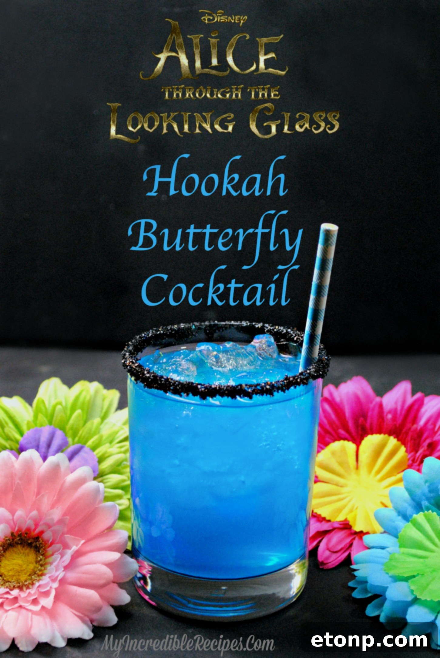 Close-up of the beautiful layered Hookah Butterfly Cocktail, highlighting the black sugared rim and the inviting blue and pink colors of the drink, ready to be enjoyed.
