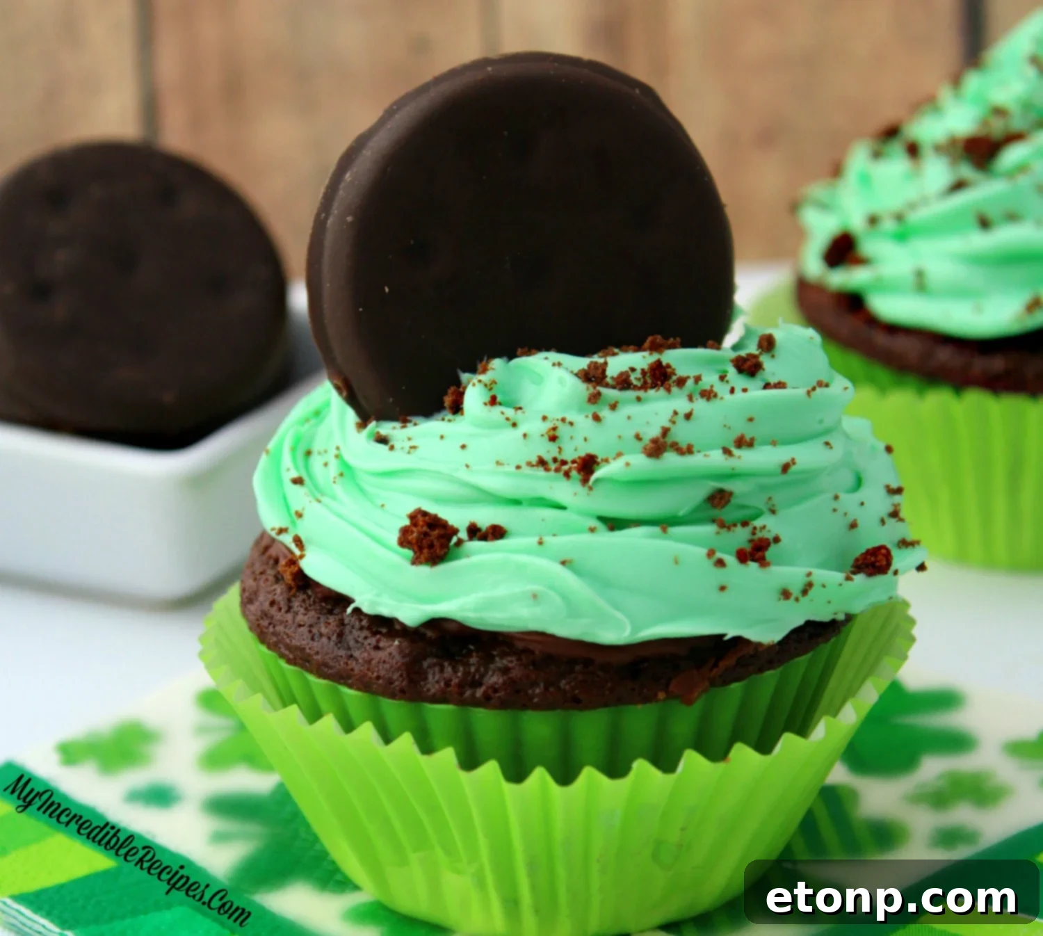 The main hero shot of exquisite Thin Mint cupcakes, beautifully garnished and ready to be served.