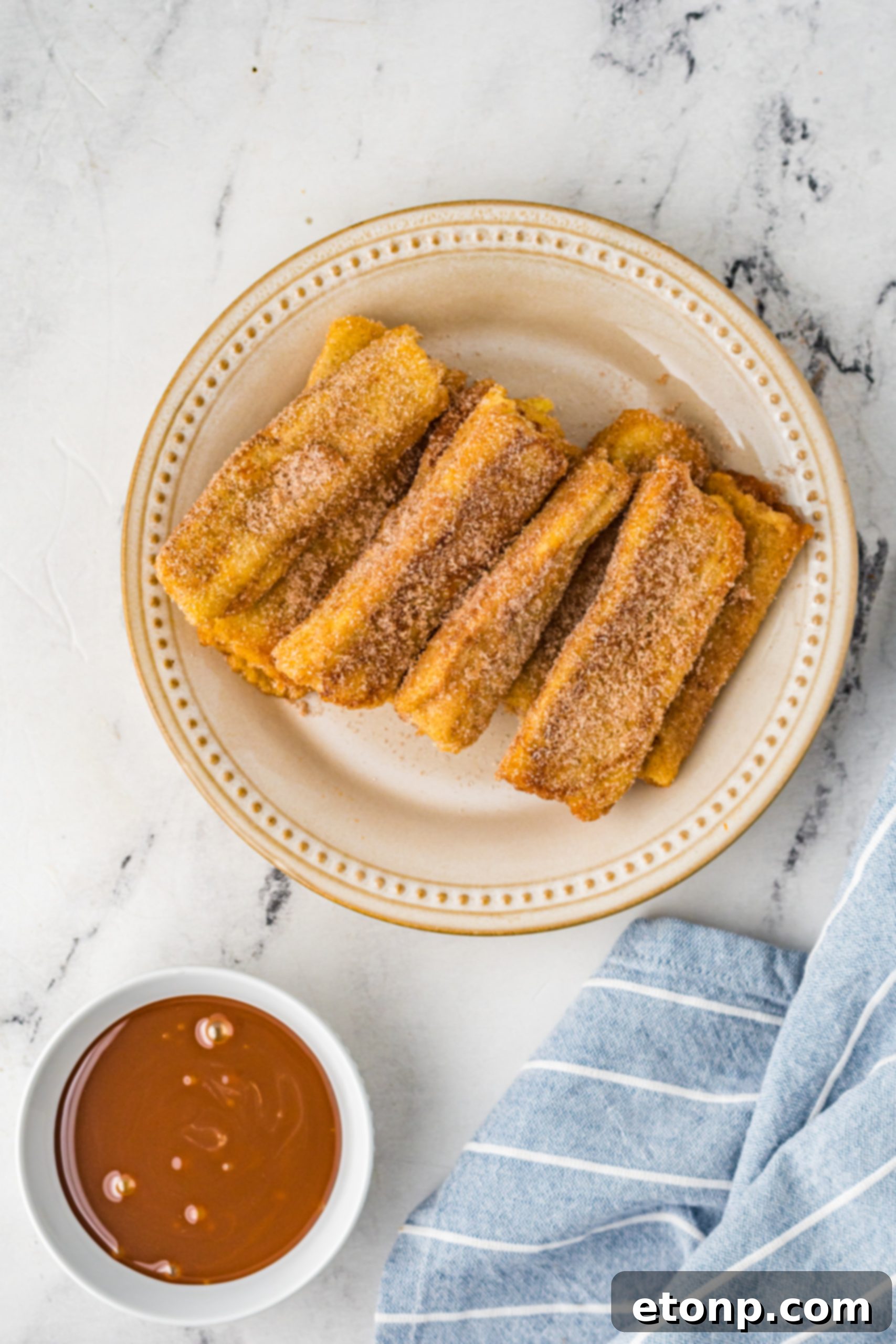 Churro French Toast Roll Ups in a pan