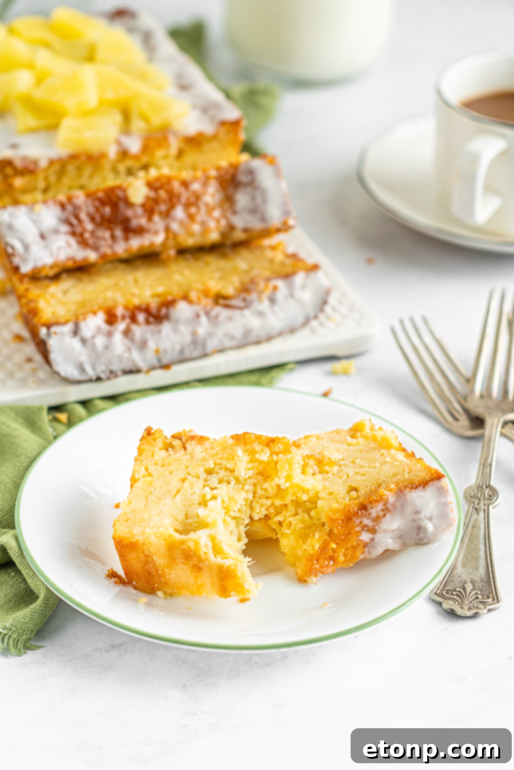Multiple slices of pineapple loaf cake on a plate