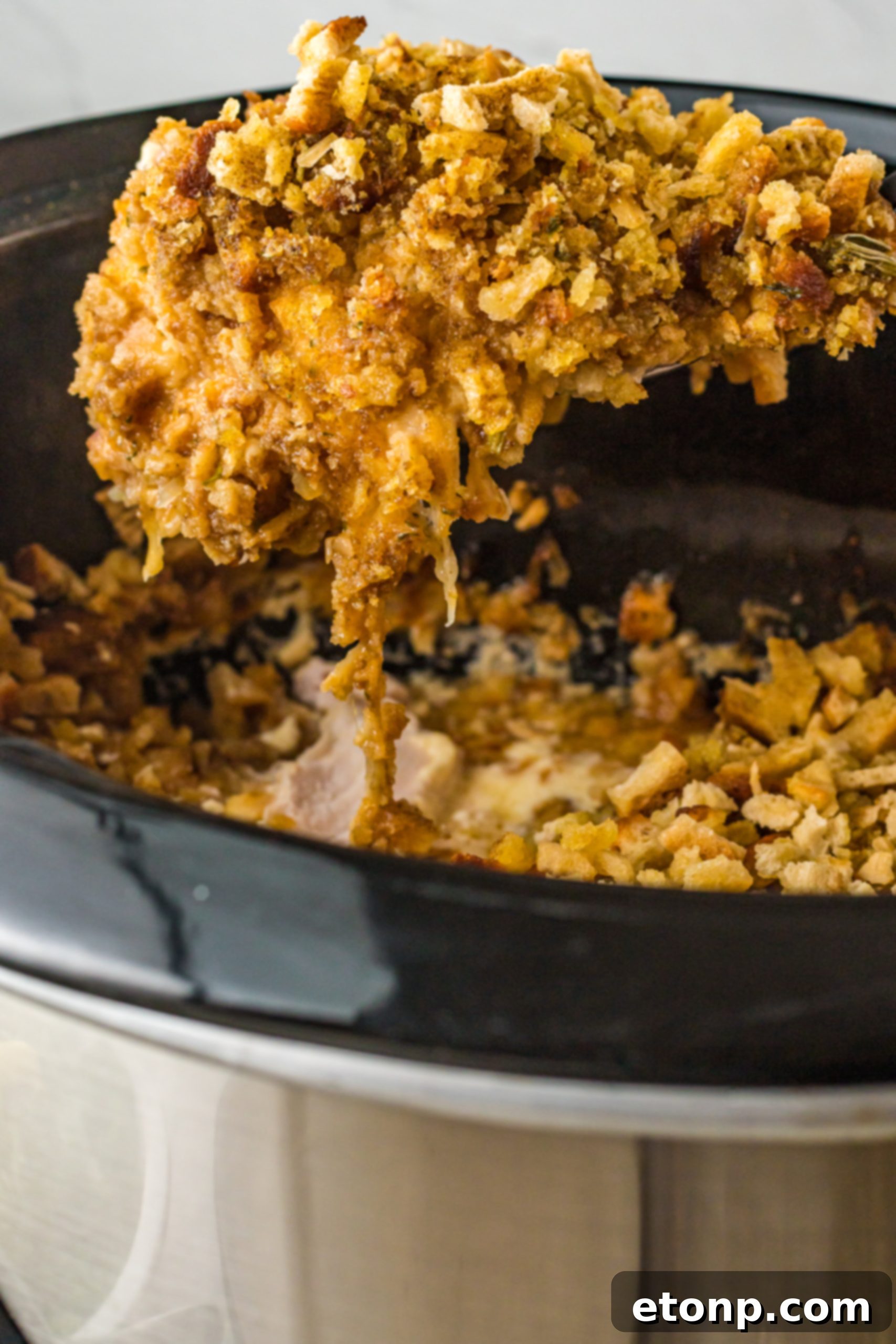Slow Cooker Chicken Cordon Bleu with Savory Stuffing 12 A serving of Slow Cooker Chicken Cordon Bleu in a bowl, garnished and ready to eat.