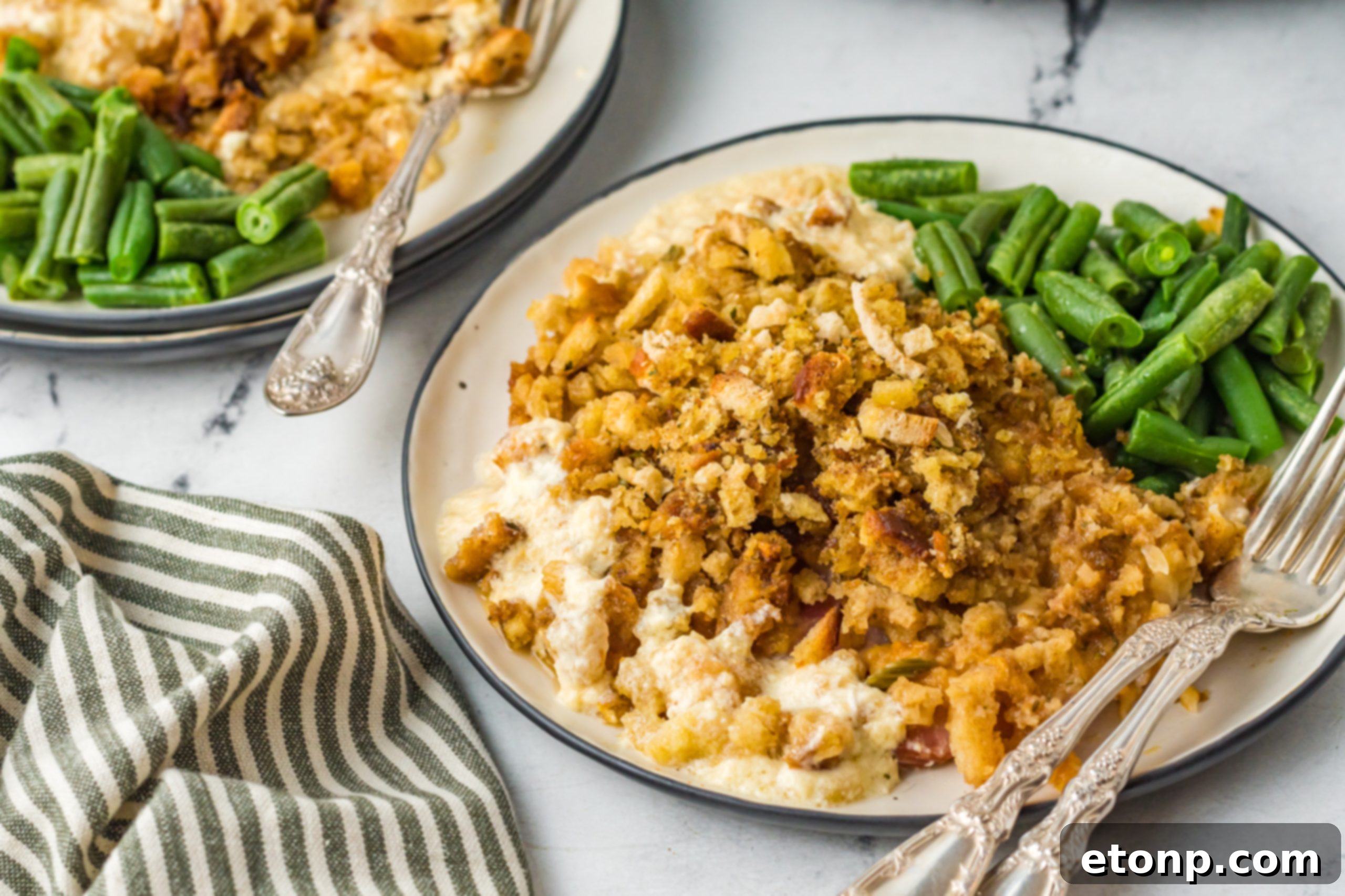 Slow Cooker Chicken Cordon Bleu with Savory Stuffing 15 Close-up of a serving of Slow Cooker Chicken Cordon Bleu, showcasing the golden stuffing and creamy layers.
