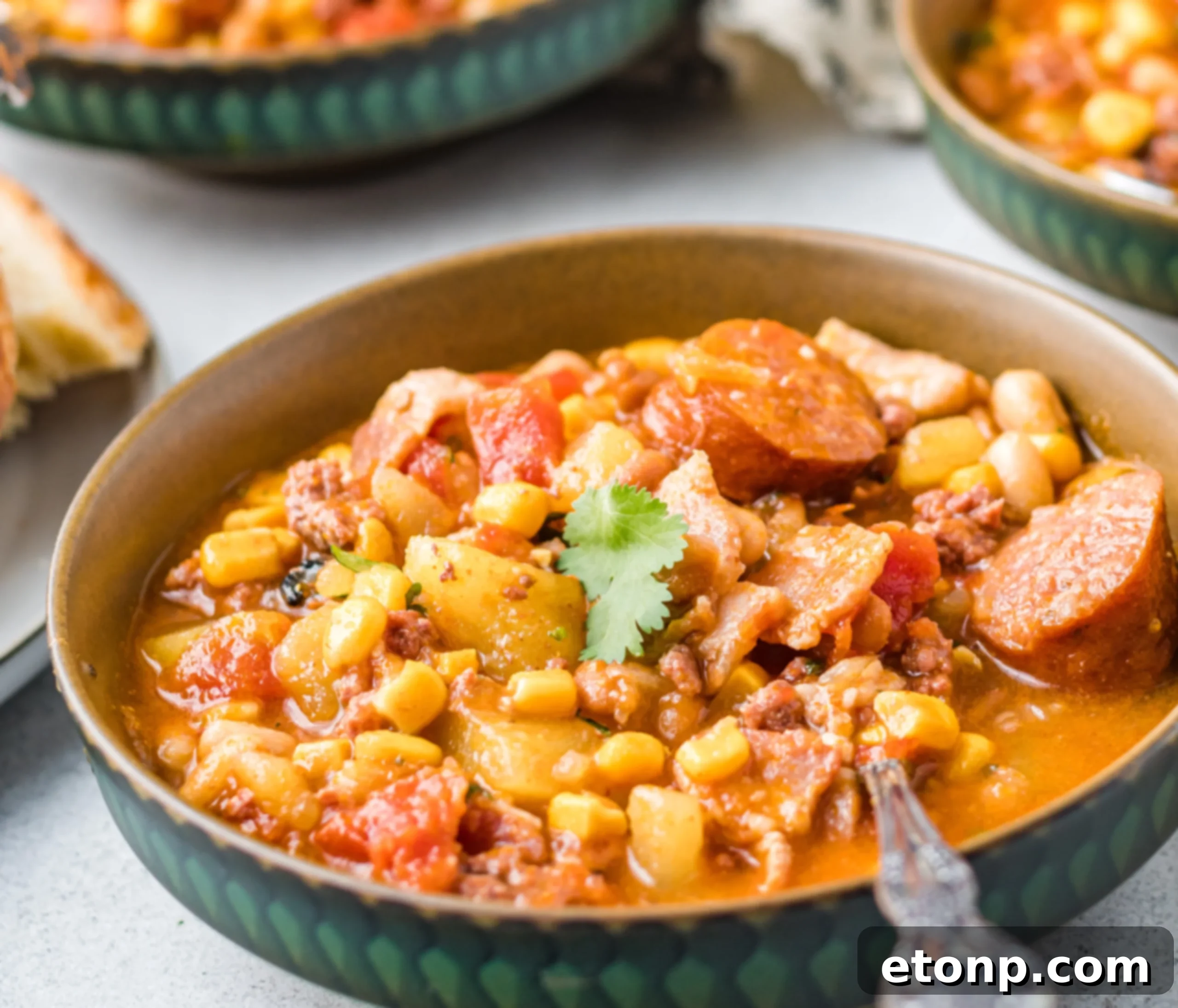 Wrangler's Frontier Stew 6 A large pot of Cowboy Stew simmering on a stove, showcasing its vibrant colors and inviting texture.