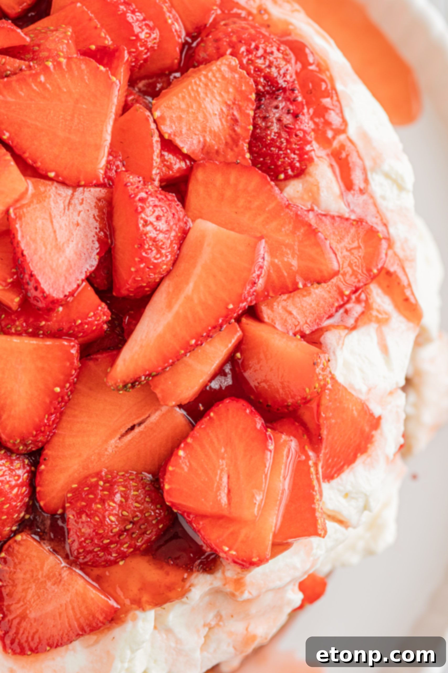 Close-up of a rustic styled Strawberry Whipped Cream Cake showing texture.