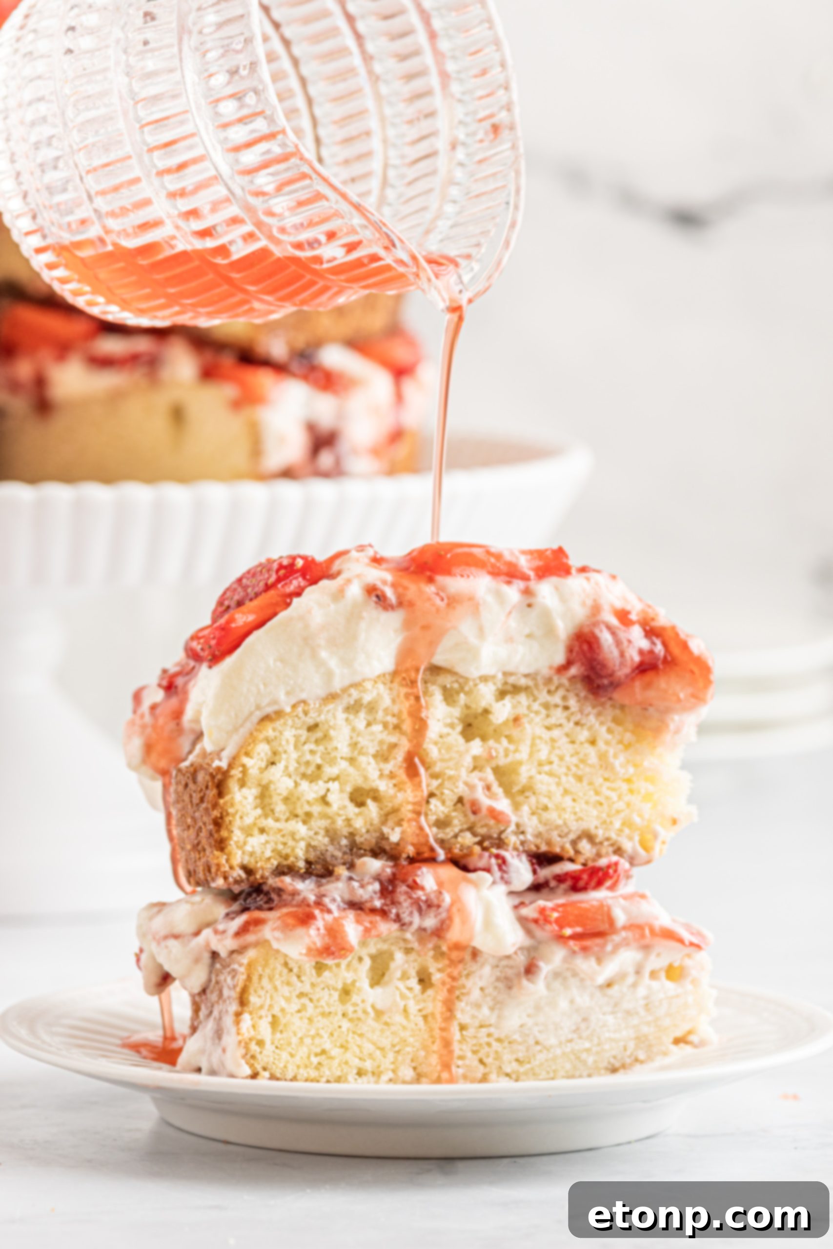 Overhead shot of the finished Strawberry Whipped Cream Cake, ready to be served.