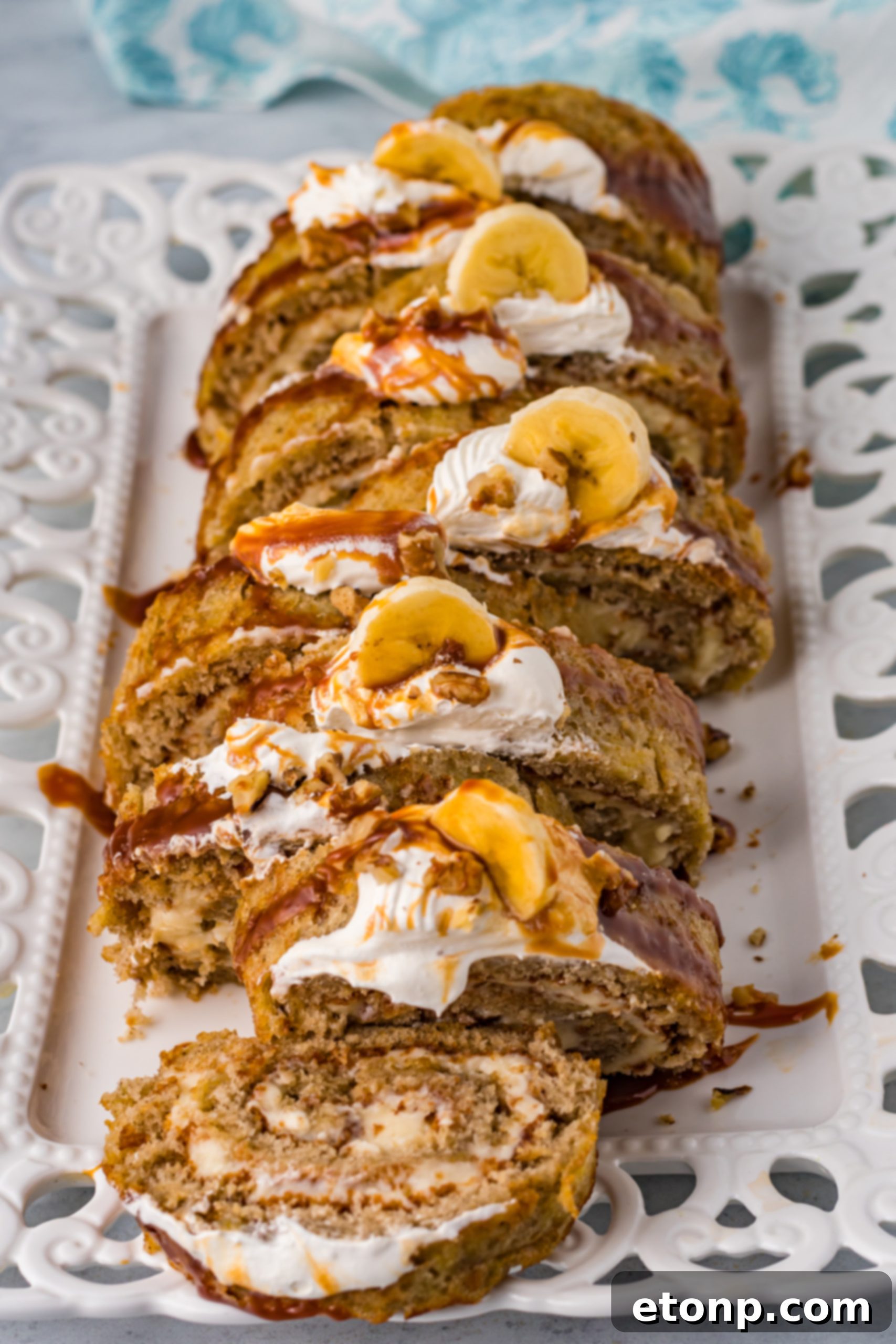Banana Cake Roll with caramel sauce and whipped cream.
