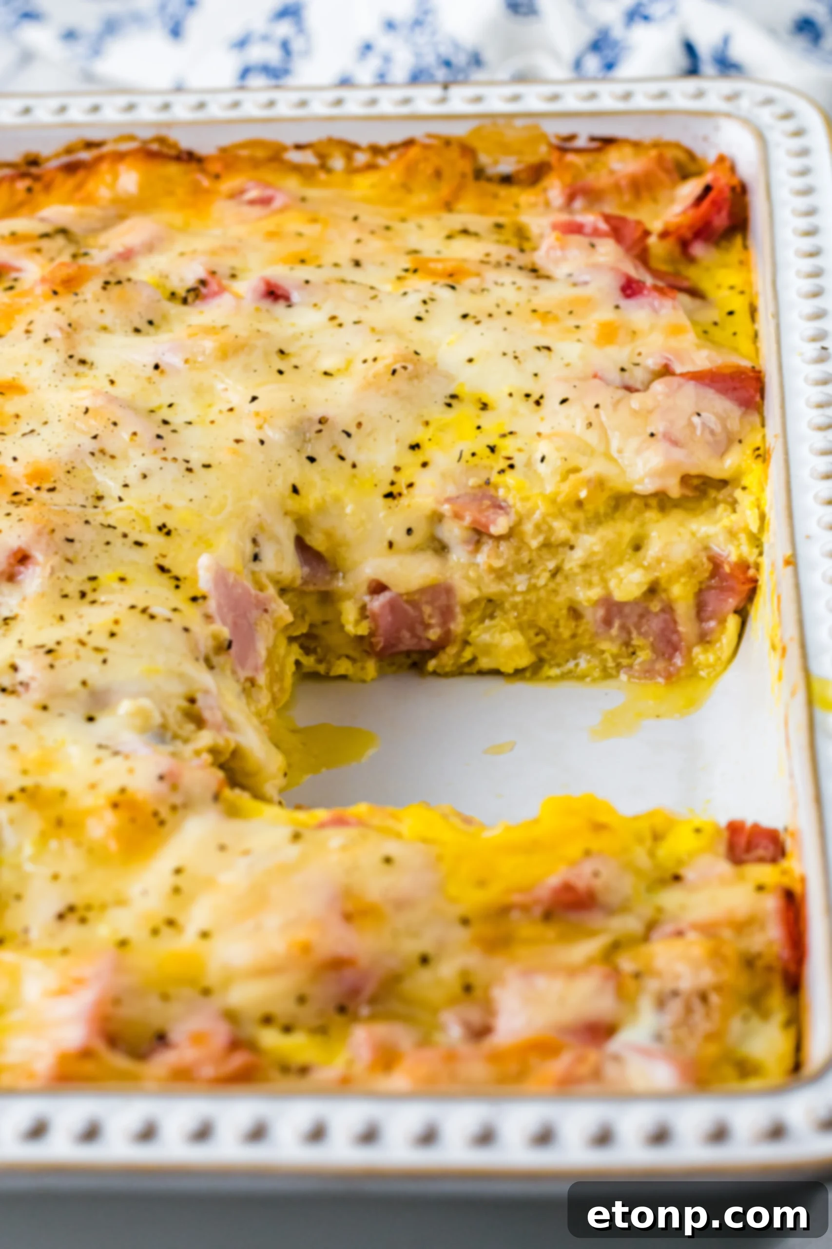 Eggs Benedict in a white casserole dish