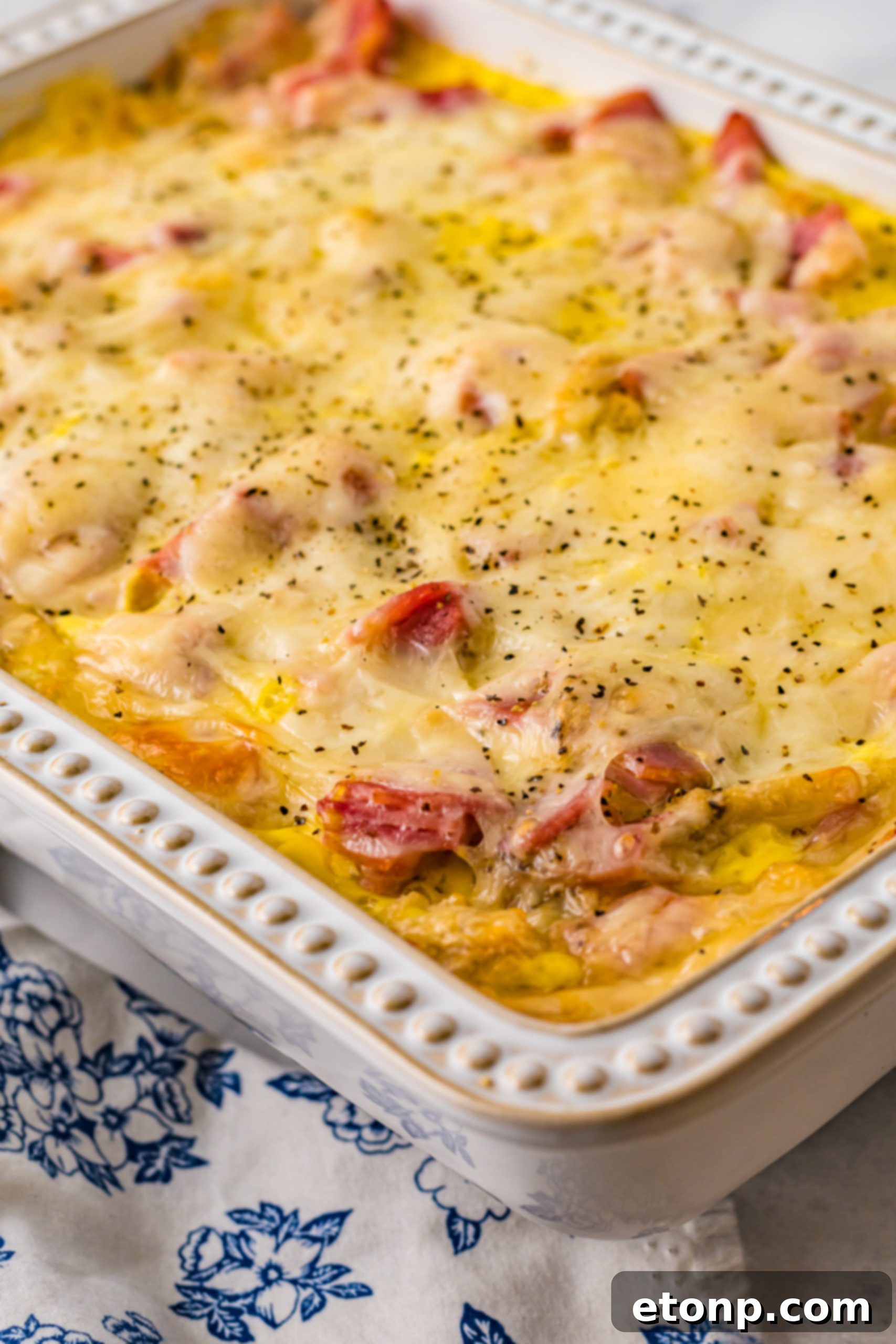 Eggs Benedict in a white casserole dish