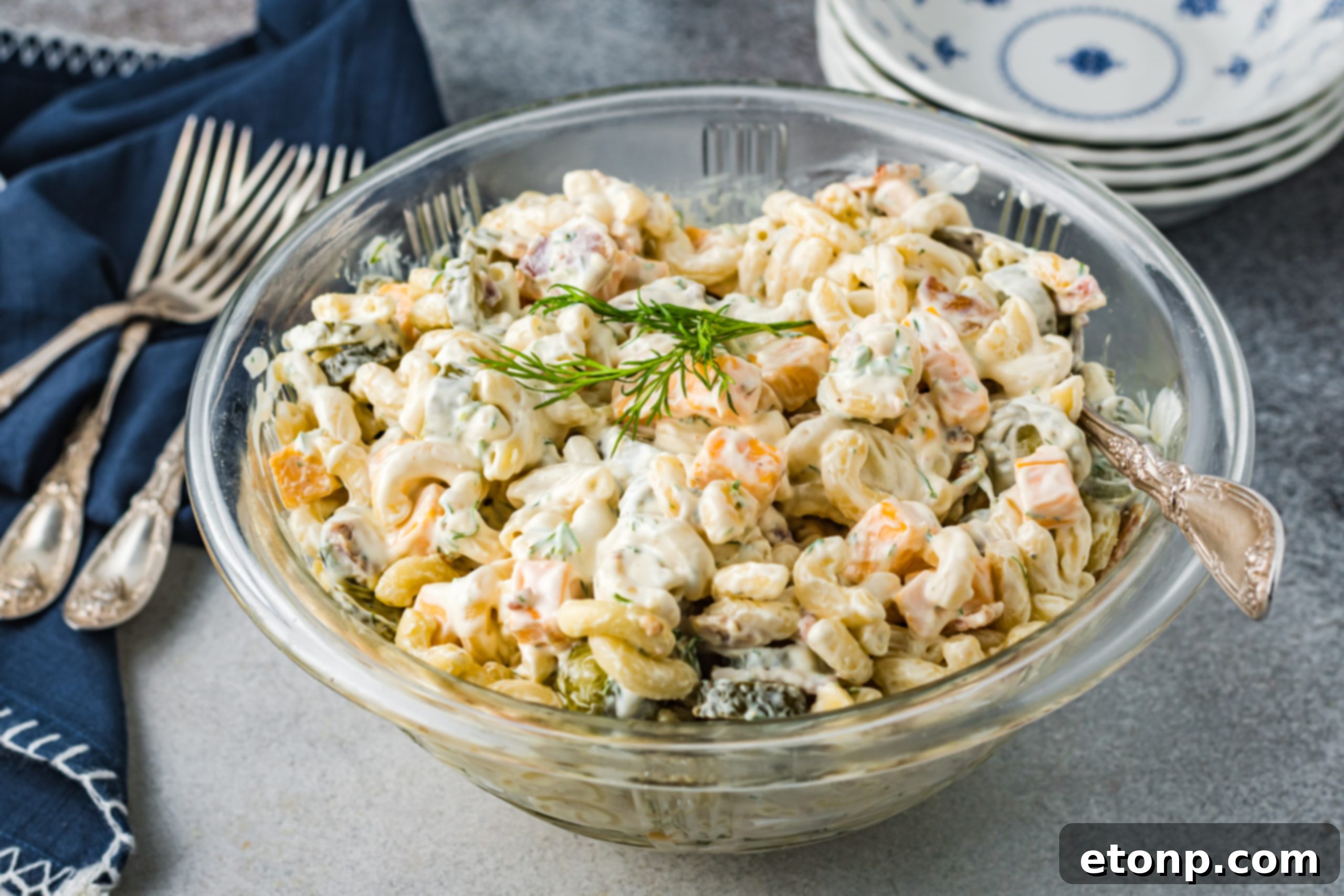 A close-up of a serving of Dill Pickle Pasta Salad in a smaller dish, highlighting its appetizing appearance.