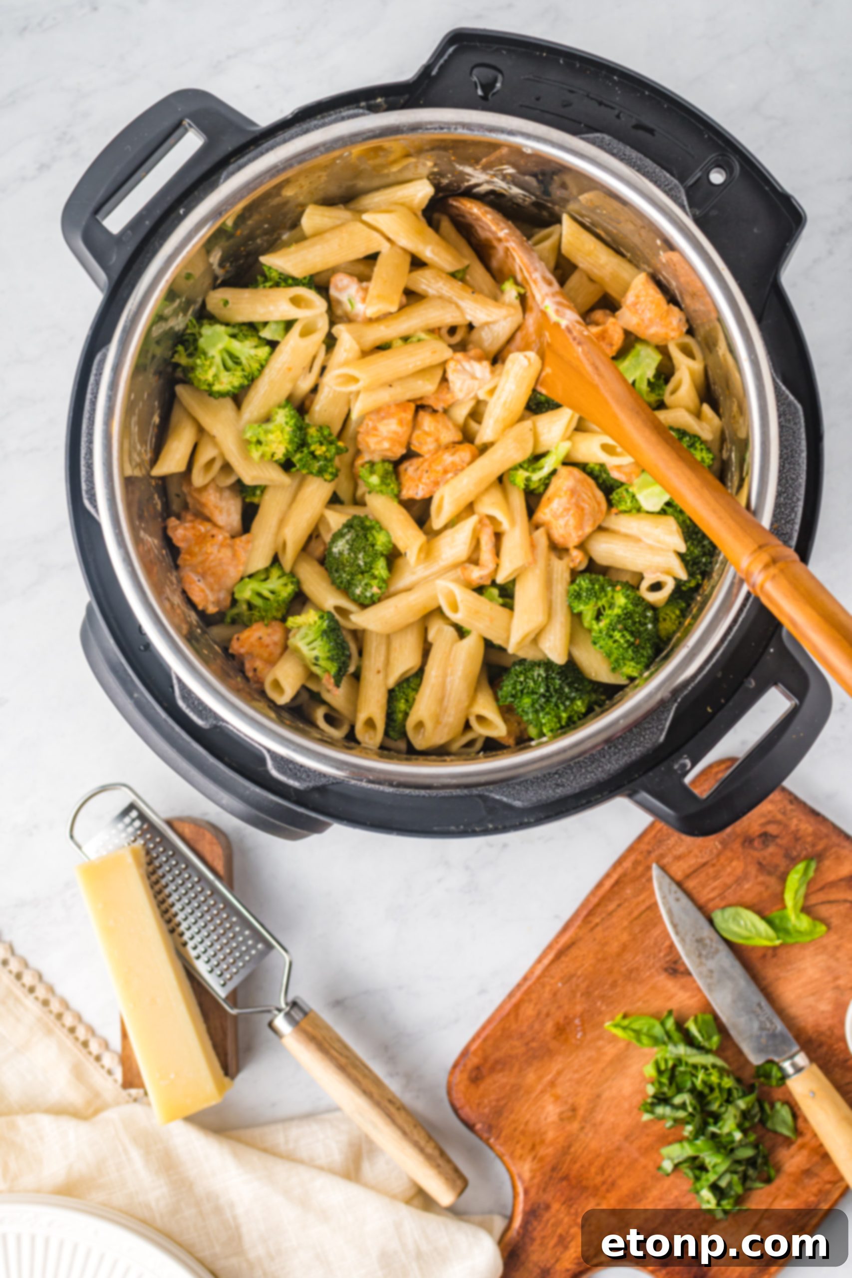 Chicken Pasta Delight 13 A wide shot of a plate of creamy chicken pasta with broccoli, beautifully arranged and ready to eat.