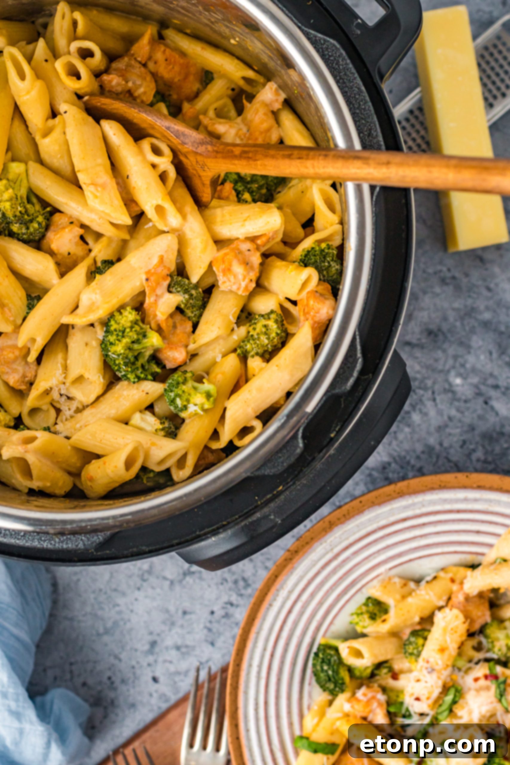 Chicken Pasta Delight 8 Cheesy chicken pasta simmering in the Instant Pot, with steam gently rising.