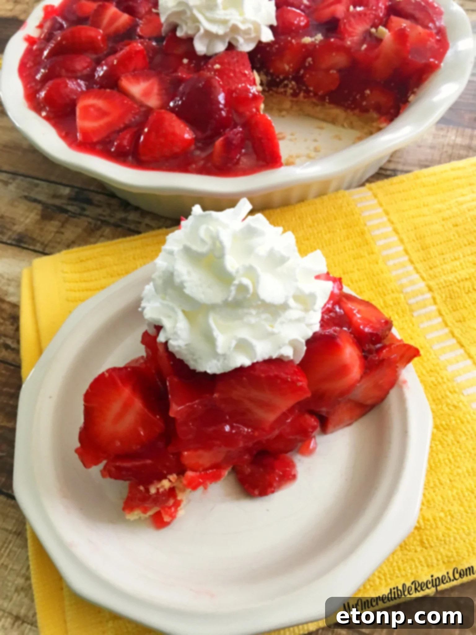 The Ultimate Strawberry Pie 12 Strawberry pie served with a dollop of whipped cream