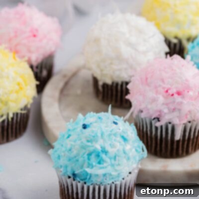 A festive Easter cupcake topped with colorful frosting and coconut.