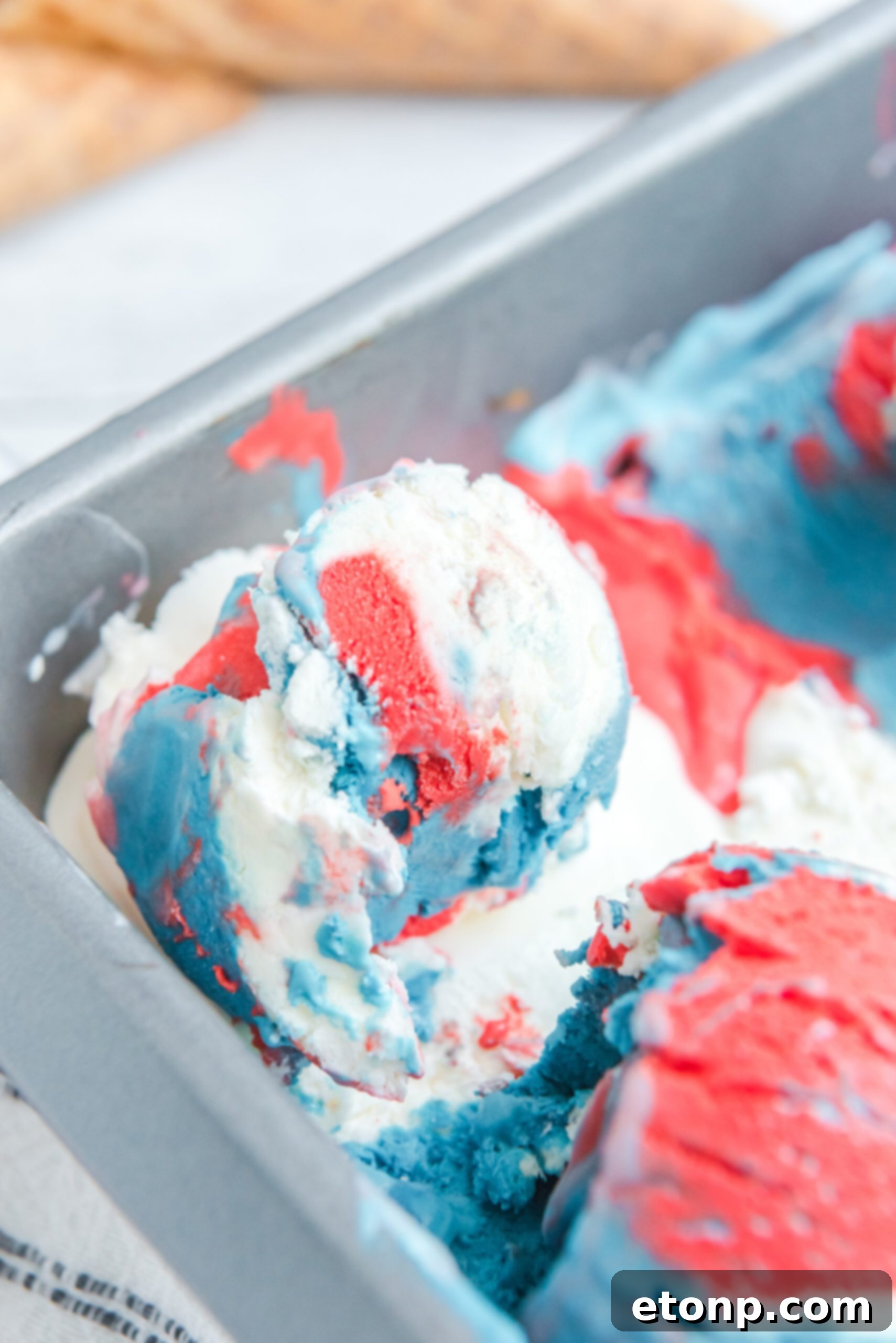 Red, White & Blue Ice Cream in an aluminum loaf pan, unscooped