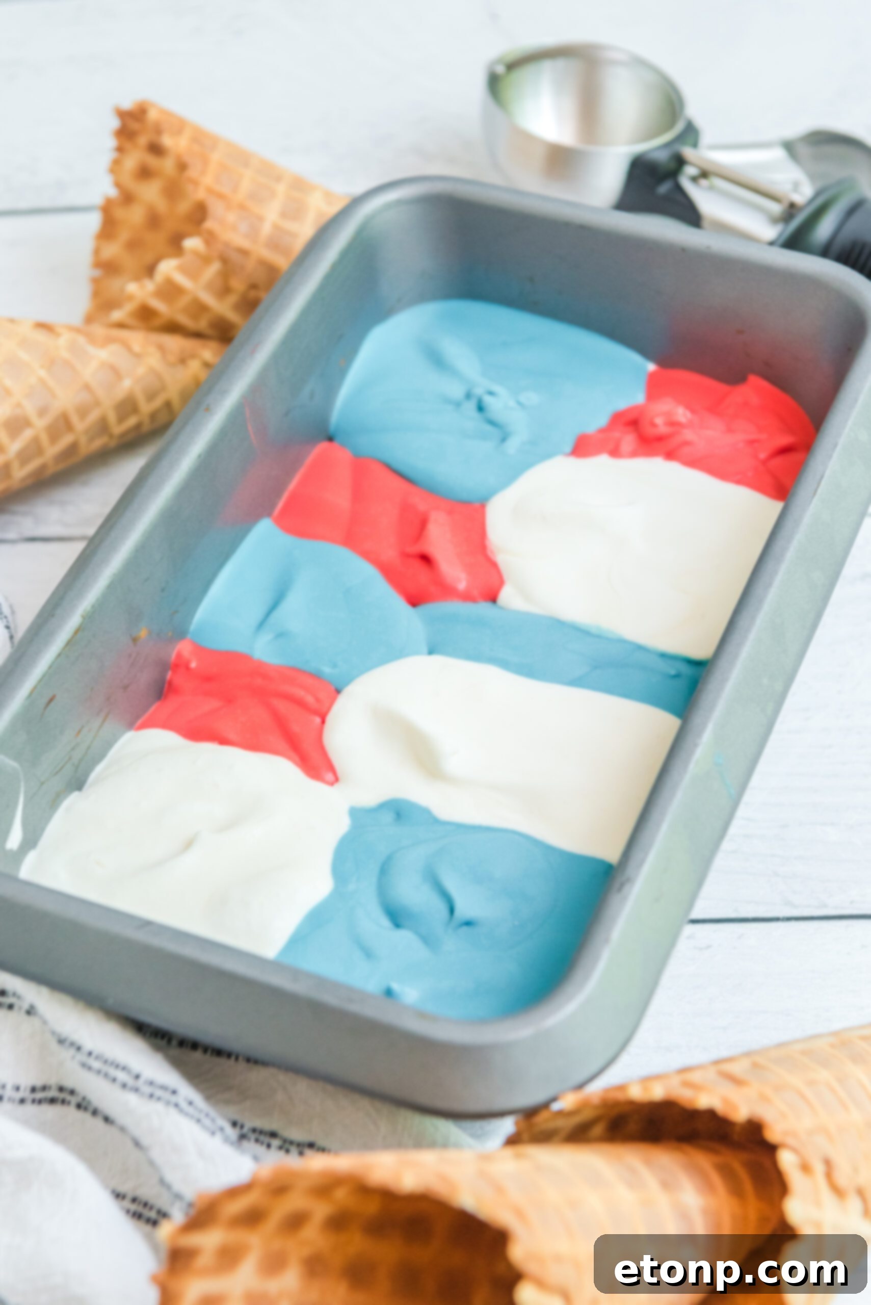 Red, White & Blue Ice Cream in an aluminum loaf pan, ready for scooping