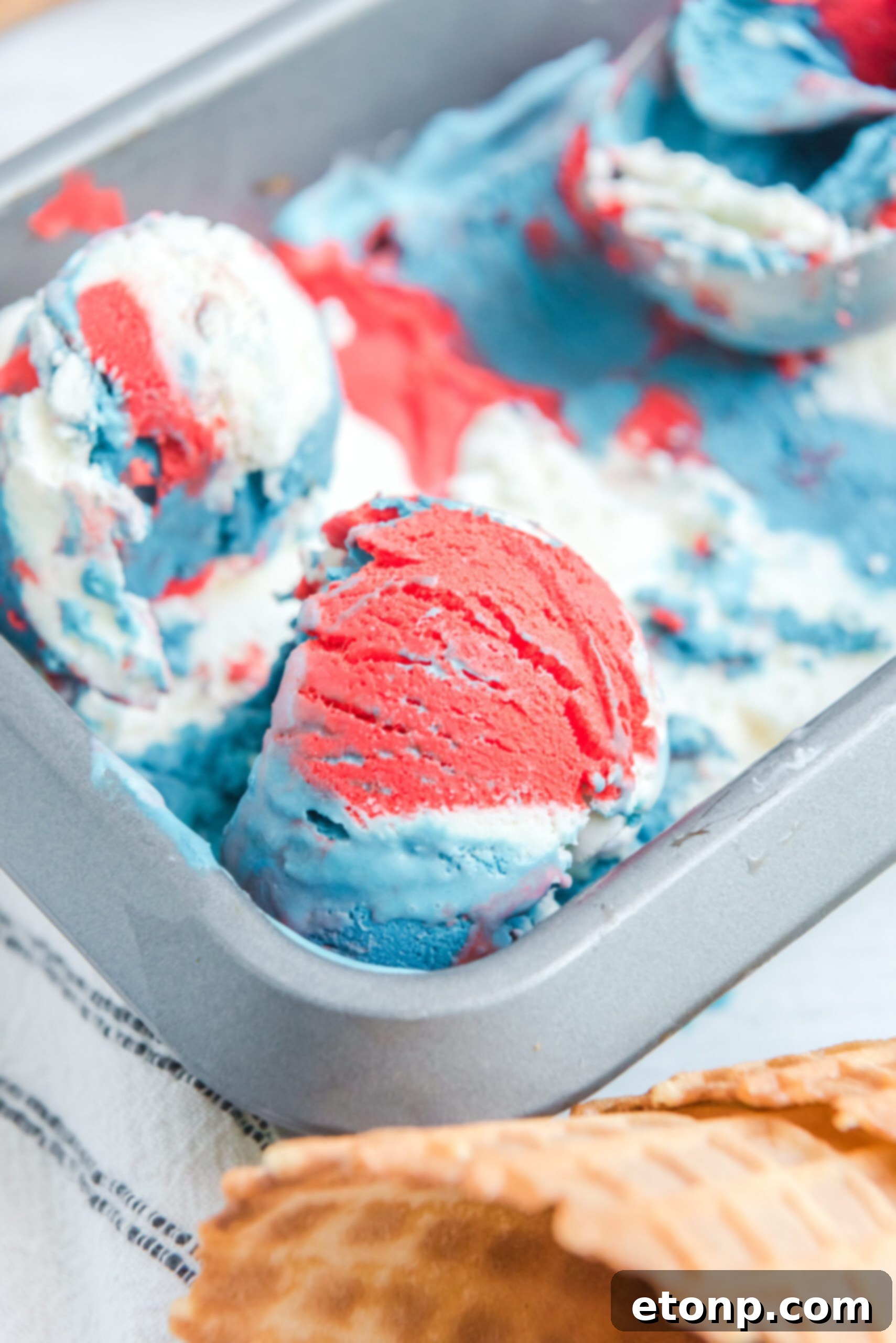 Red, White & Blue Ice Cream in an aluminum loaf pan from the side