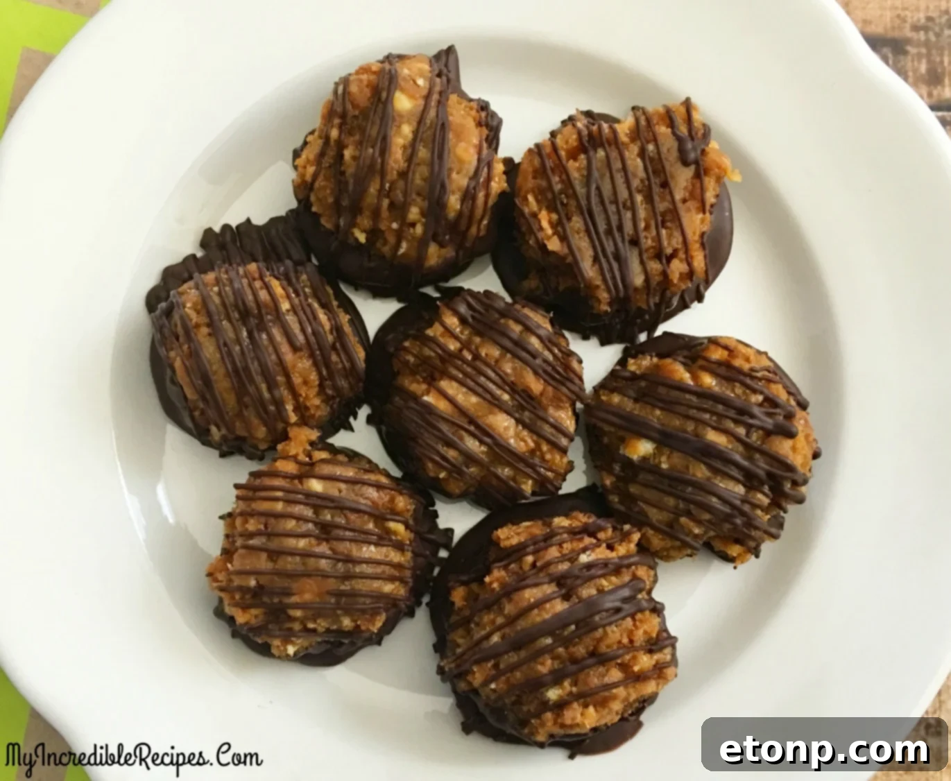 A final close-up shot of the finished Samoa Bites, highlighting their enticing texture and topping.