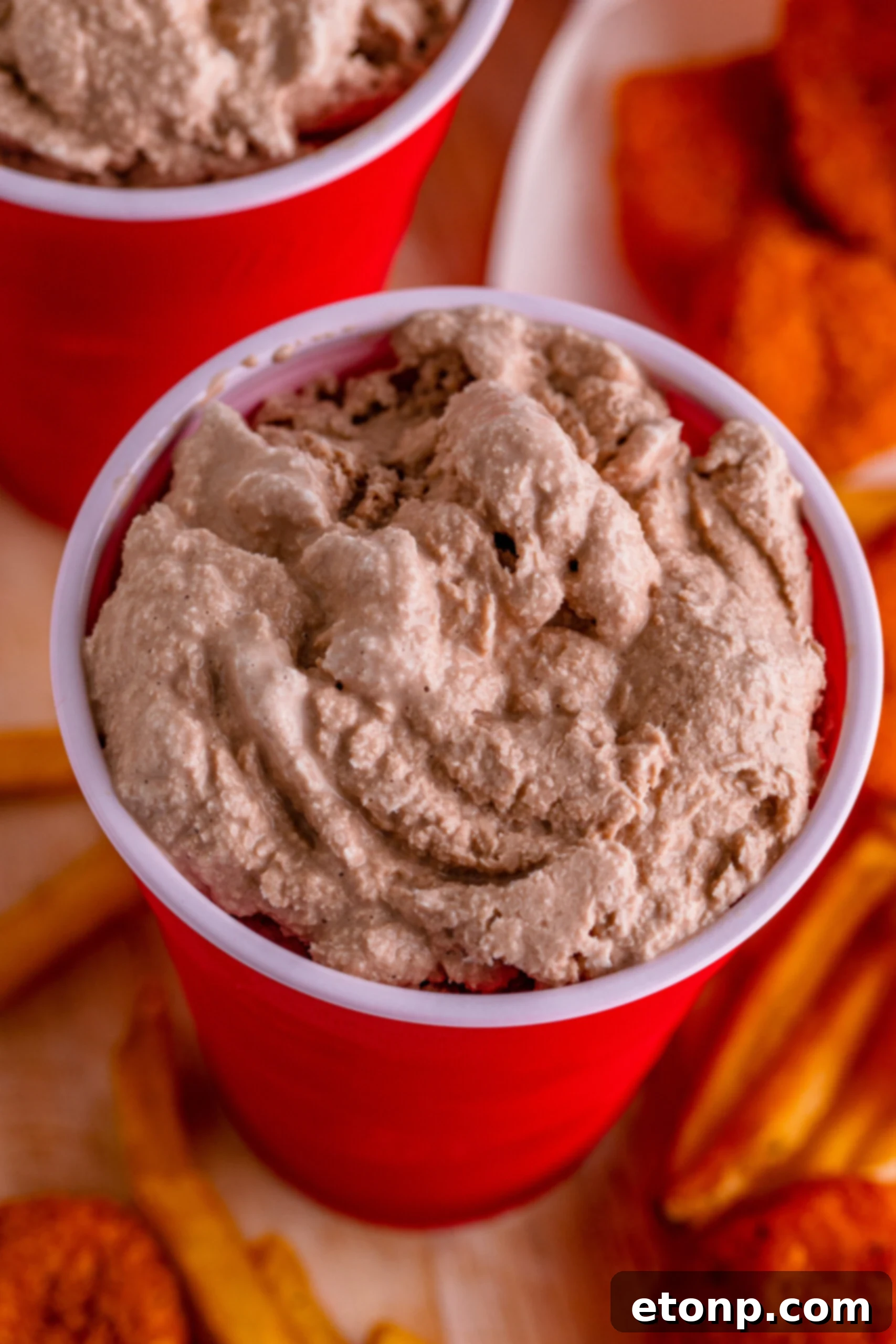 Overhead close-up shot of a homemade Wendy's Frosty in a red solo cup, highlighting its thick, smooth, and appealing texture.