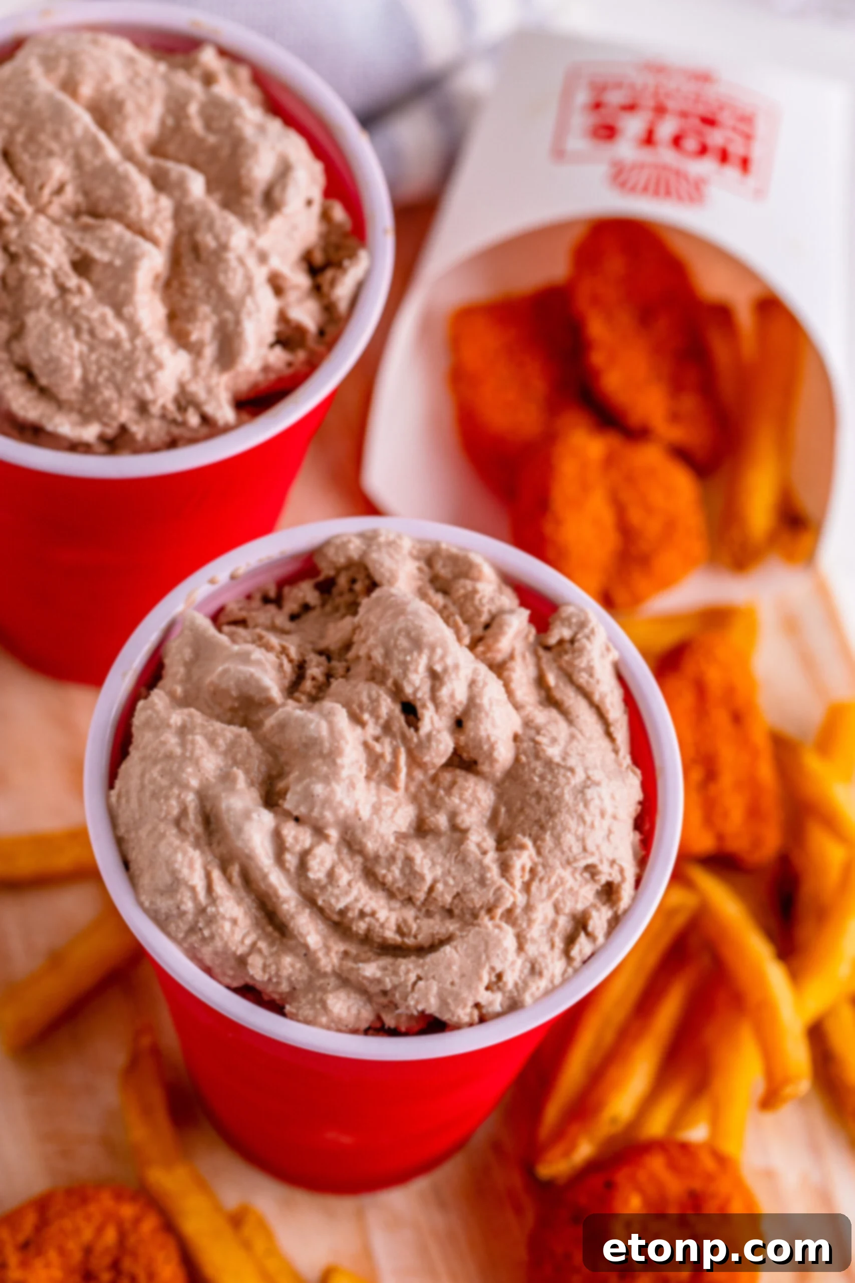 A perfectly frozen homemade Wendy's Frosty in a red solo cup, ready to be enjoyed.
