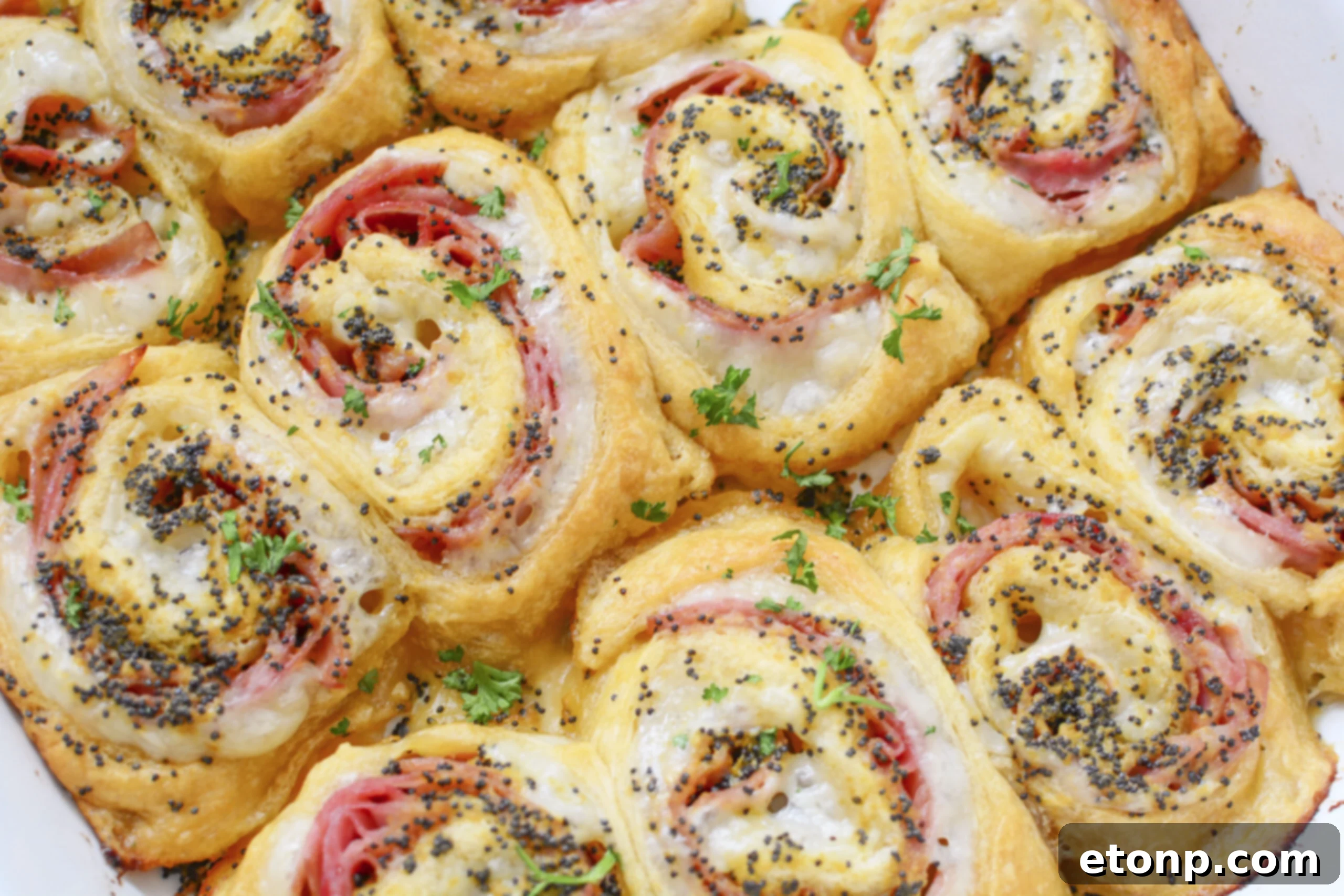 Ham and Cheese Pinwheels in a white baking dish