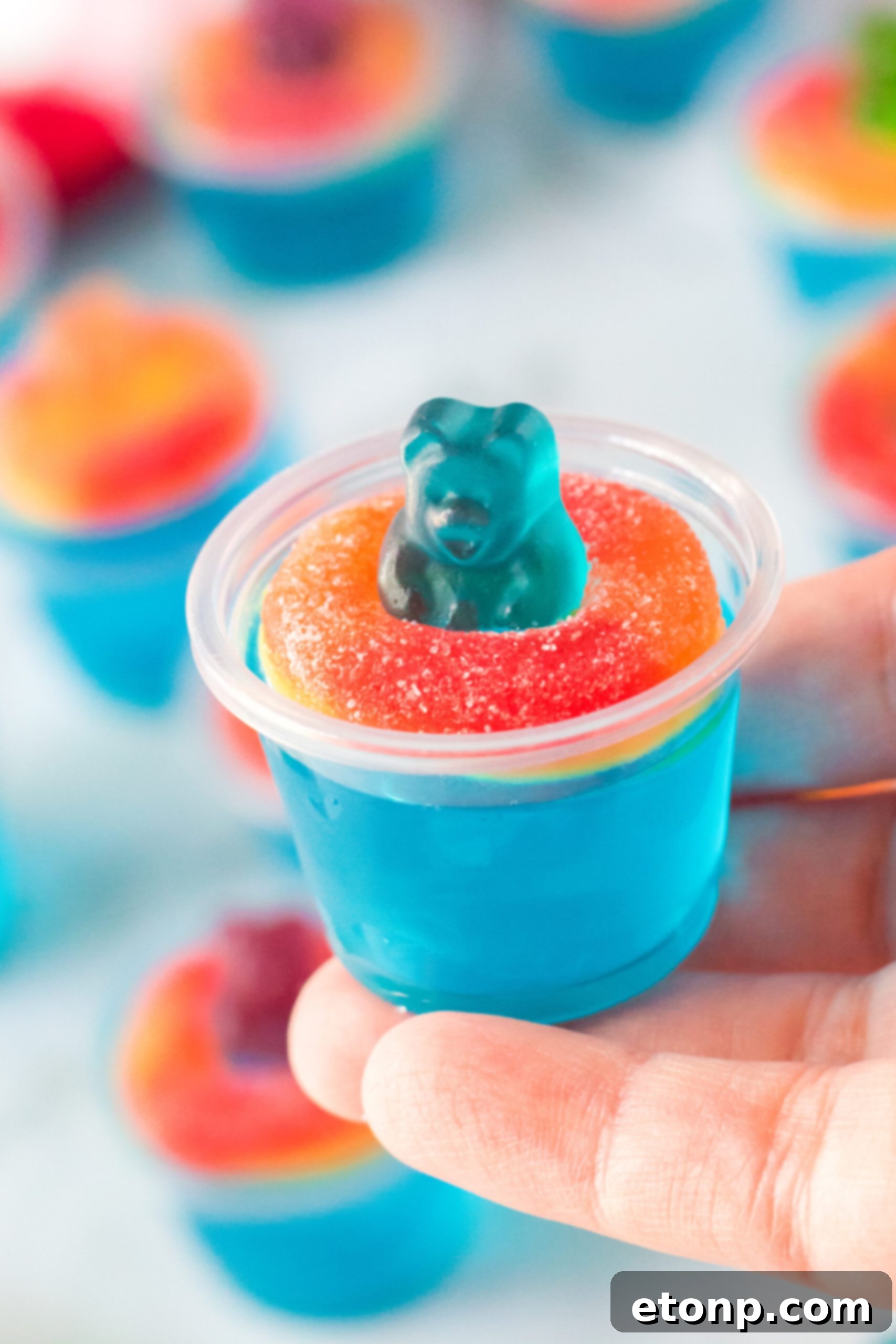 Summer Splash Jello Shots 7 Pool Party Jello Shot being held in a hand