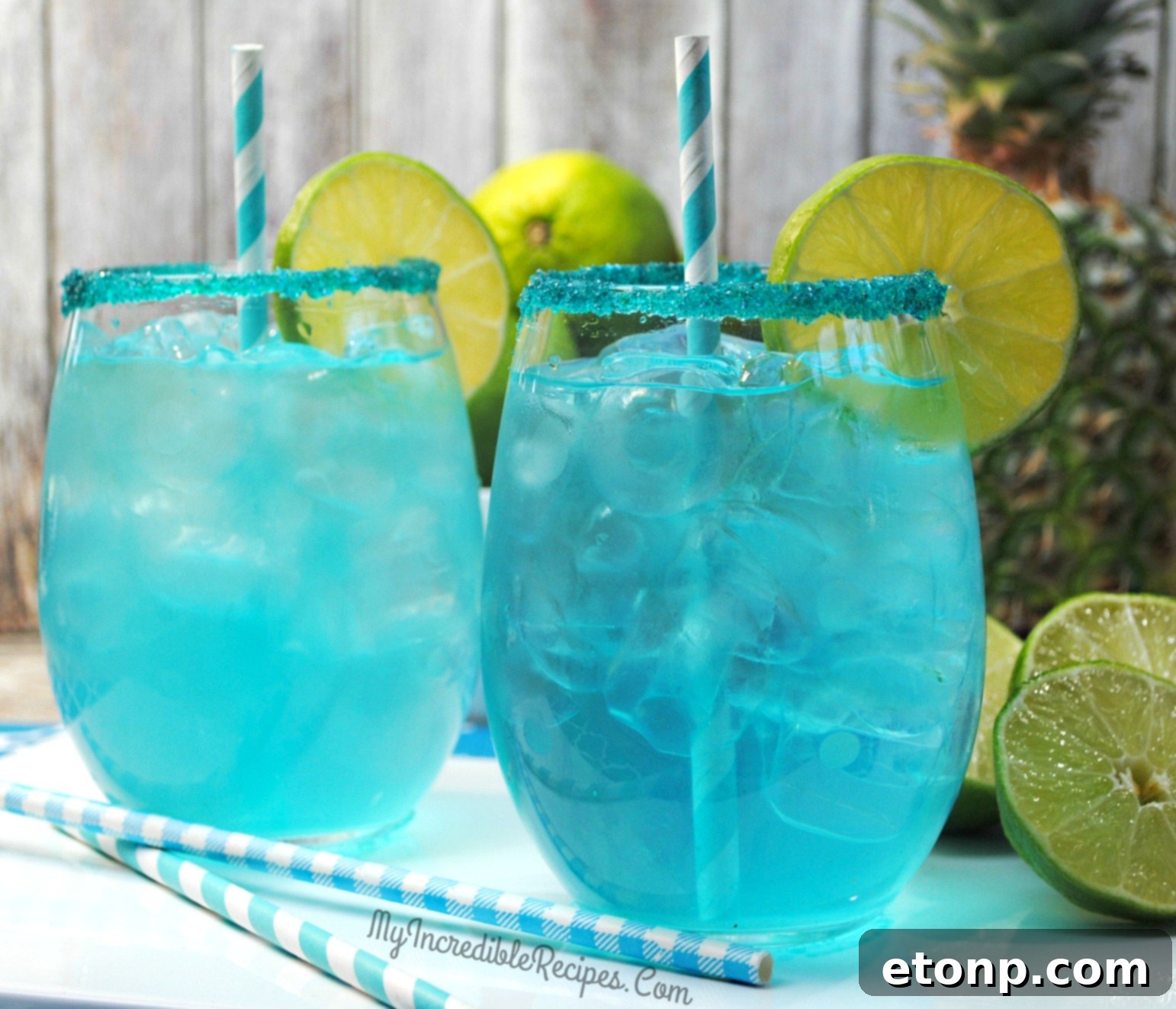 Close-up of a Kinky Pineapple Margarita, showcasing its bright blue color and tropical allure.