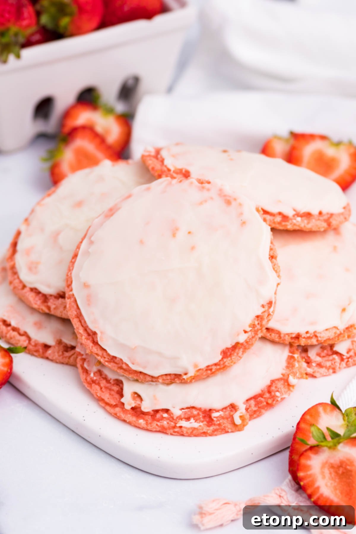Close up shot of a single Strawberry Cool Whip Cookie, showcasing its texture and glaze