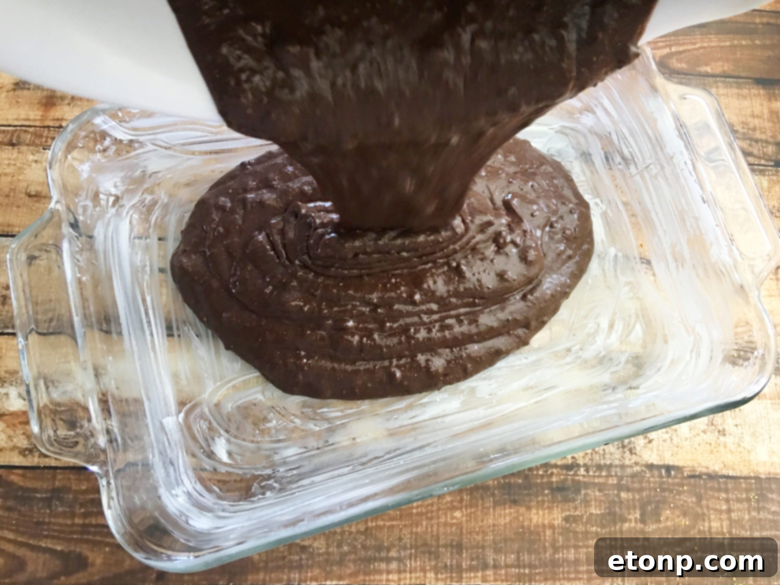 A box of chocolate cake mix displayed prominently, emphasizing the simple starting point for this delicious dessert.