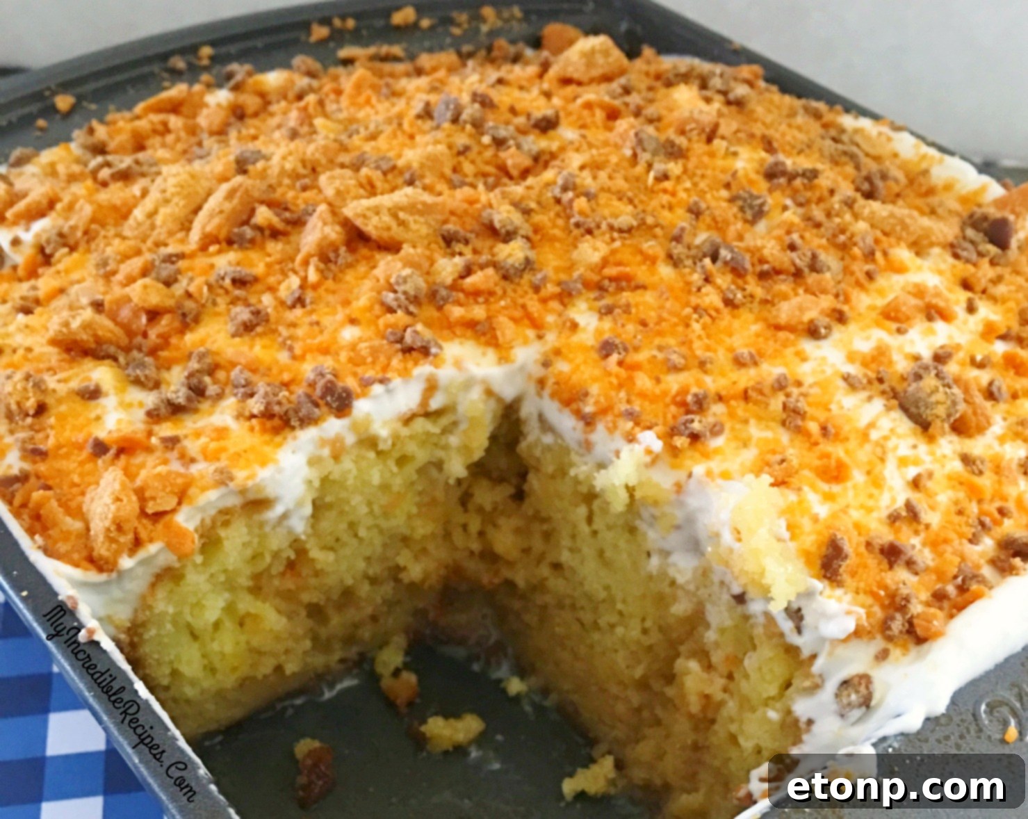 Butterfinger Bliss Cake 11 overhead view of a full Butterfinger Caramel Poke Cake
