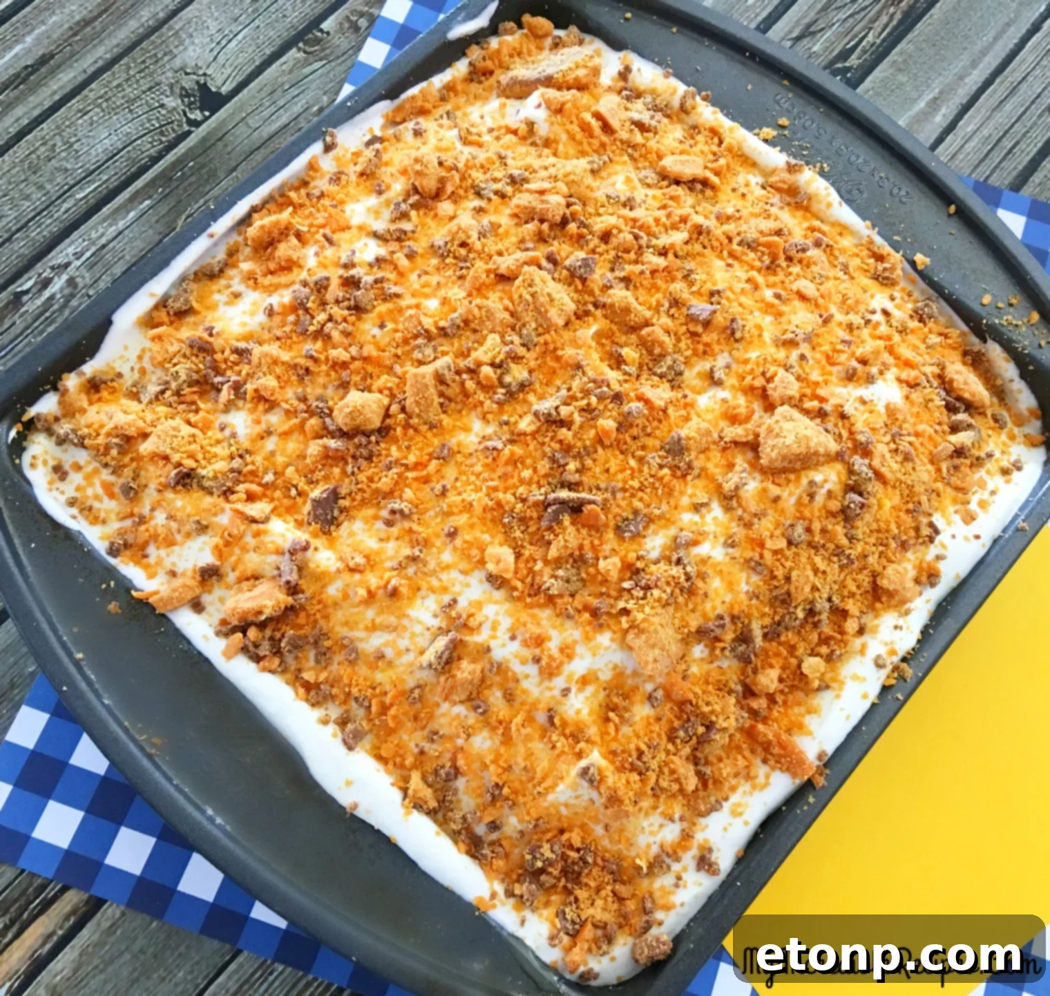 Butterfinger Bliss Cake 9 finished Butterfinger Caramel Poke Cake ready to serve