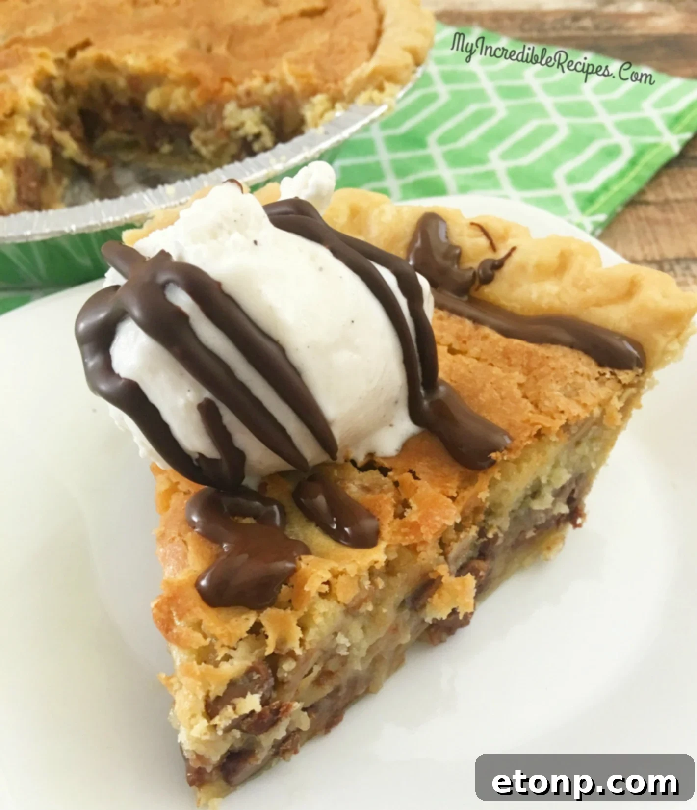 A slice of chocolate chip pie on a plate, ready to be enjoyed by everyone