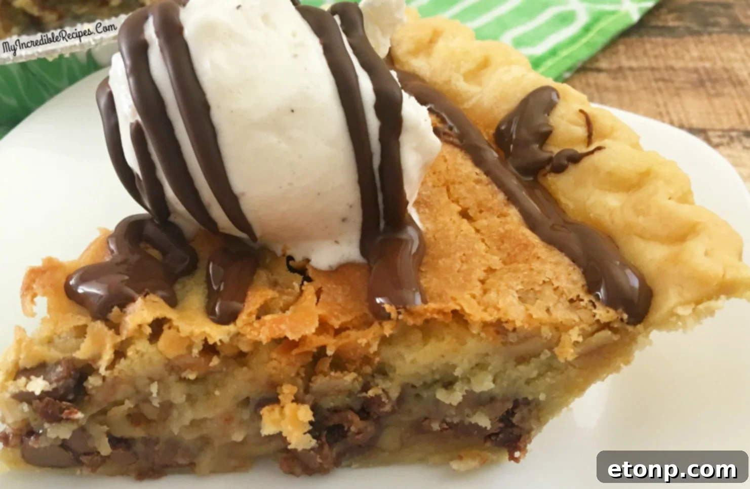 A spoonful of chocolate chip pie filling with visible walnuts
